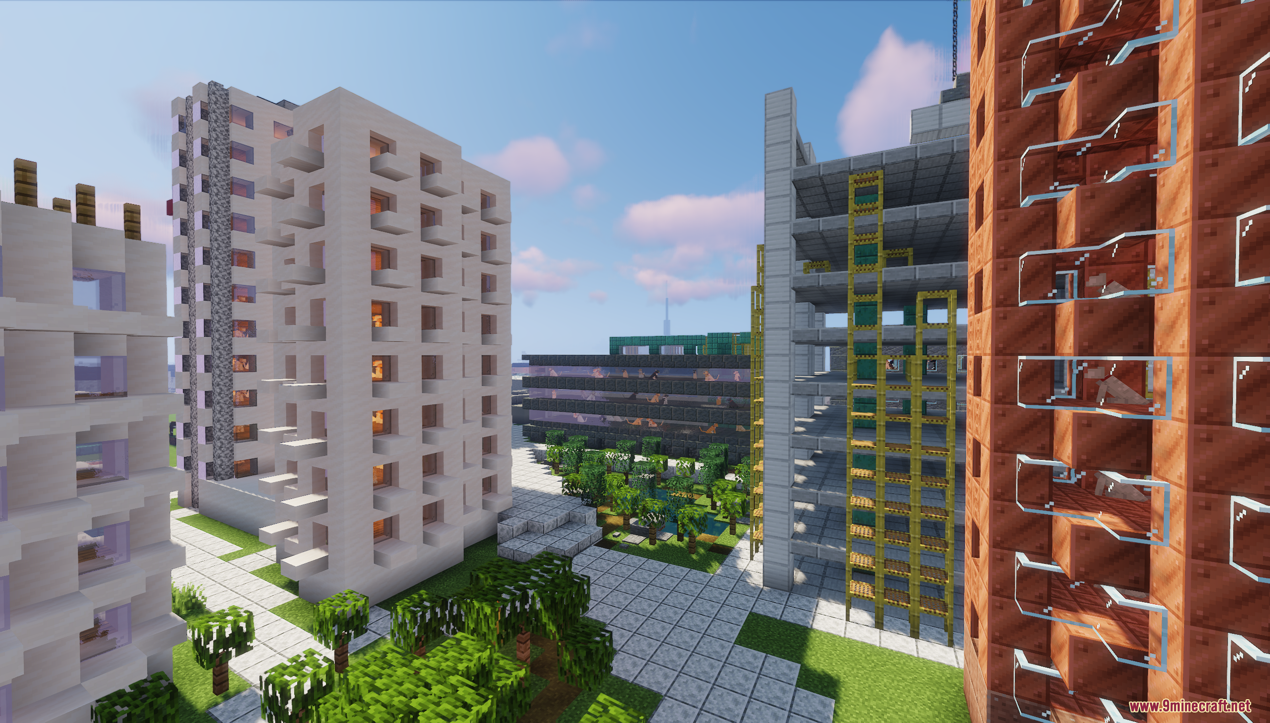 Modern apartment buildings and a green courtyard in cat city