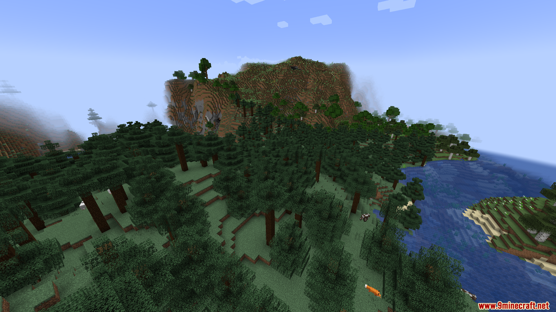 Ender Io Custom Capacitors Mod (1.21.1, 1.20.1) – Adds Custom Capacitor Tiers 12 Aerial perspective of a forest biome near a river and large mountain