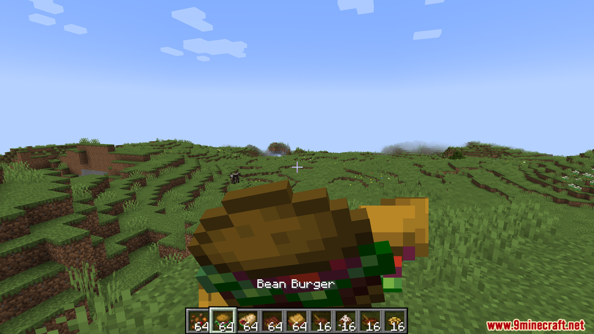 Player holding a bean burger item in their hand