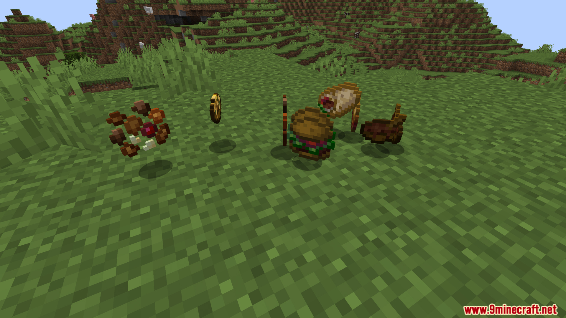 Assortment of crafted meals including burgers and wraps on the grass
