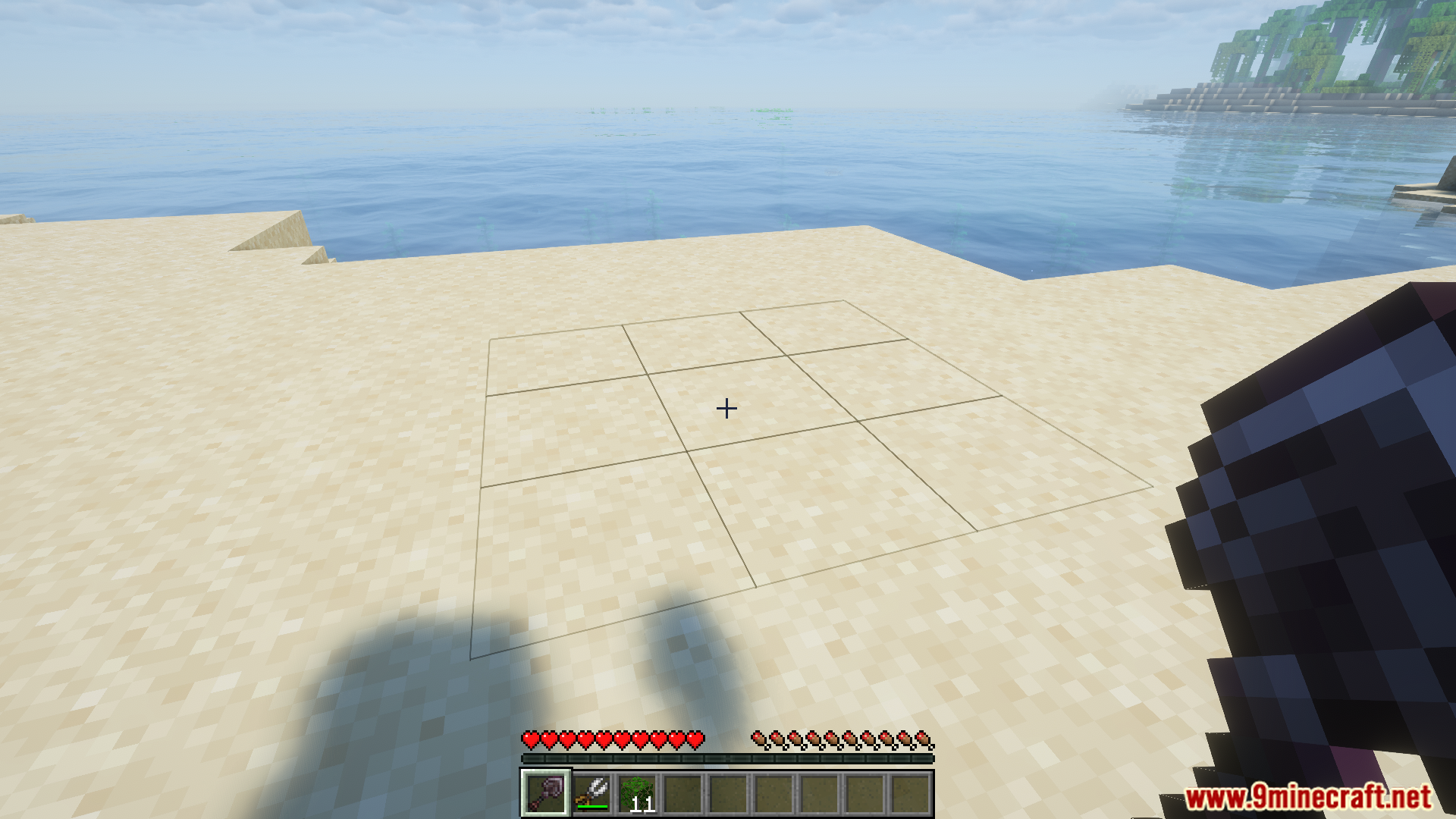 Tokimis toolshed mod excavator aiming at a large grid on sand