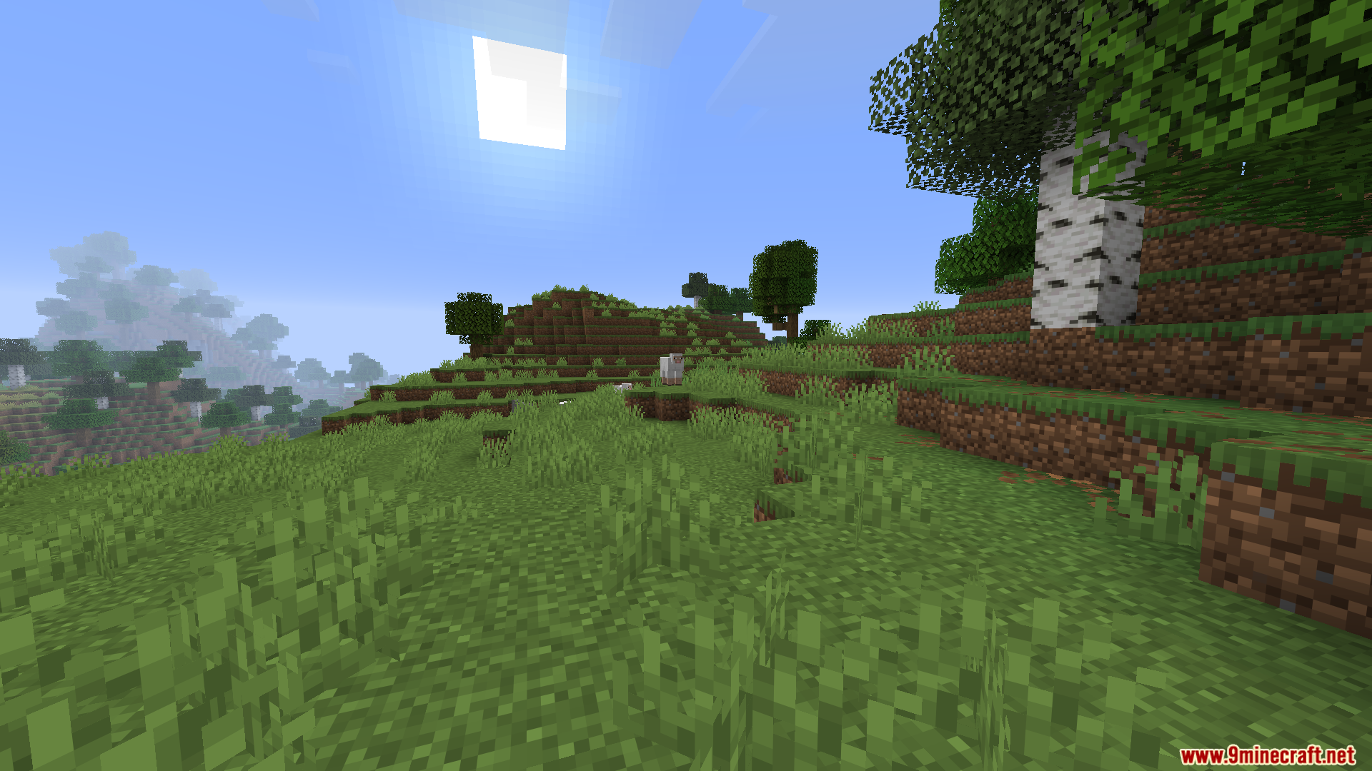 Worldweaver Neoforge Mod (1.21.11, 1.21.1) – Ports Worldweaver To Neoforge 7 Grassy hillside with sheep and trees under a bright sun