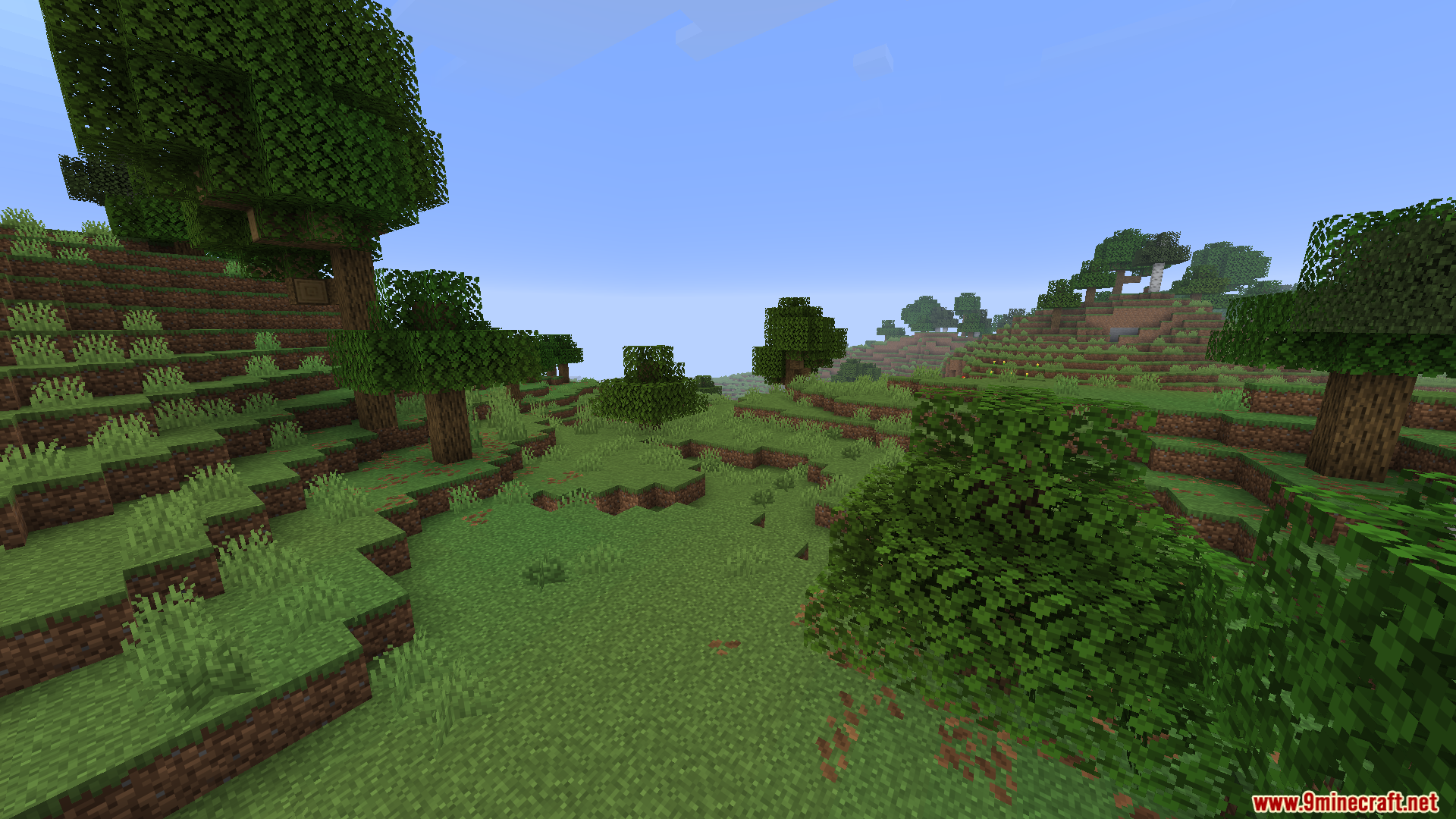 Worldweaver Neoforge Mod (1.21.11, 1.21.1) – Ports Worldweaver To Neoforge 8 Lush green valley landscape featuring scattered oak trees and bushes