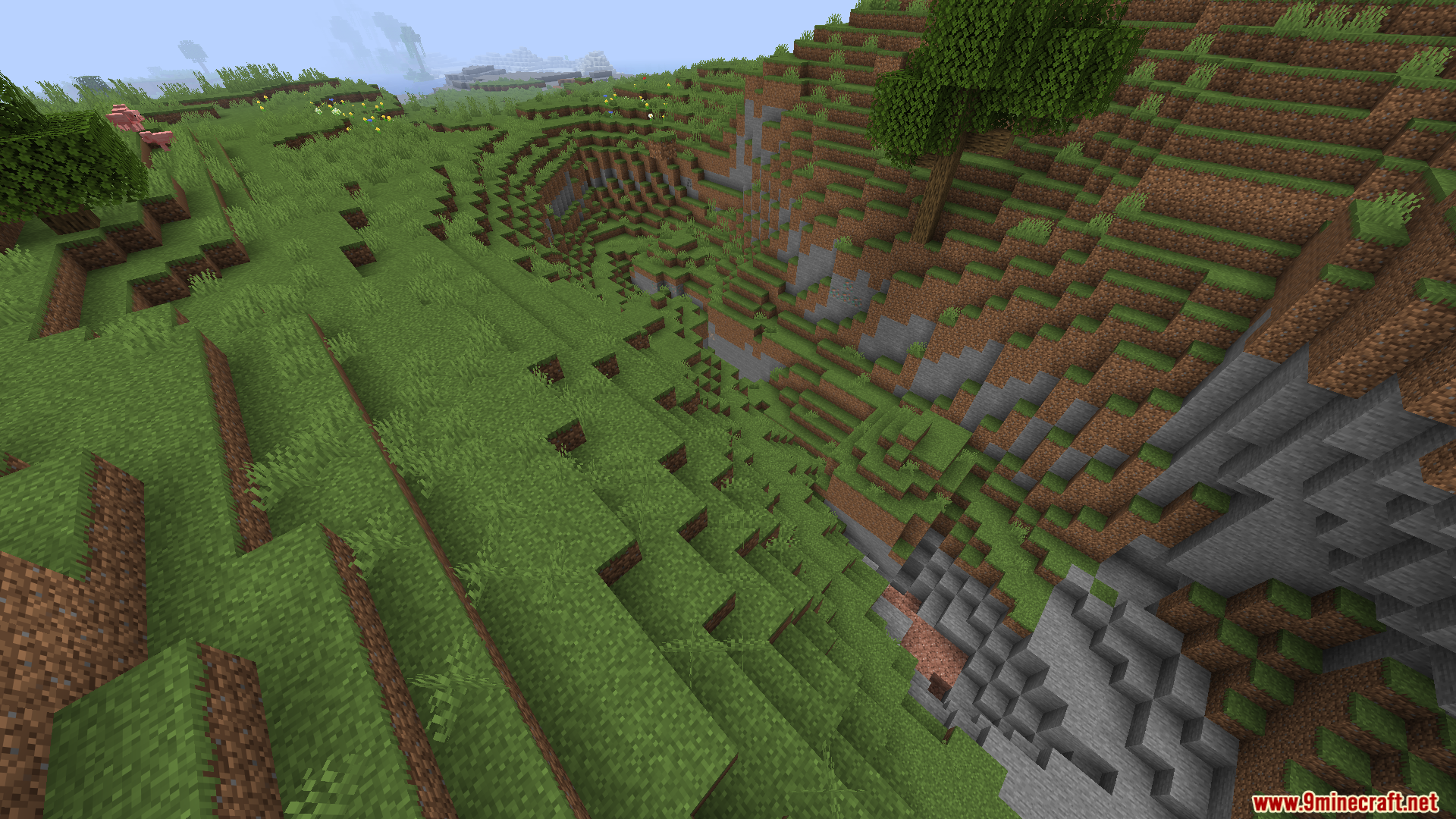 Worldweaver Neoforge Mod (1.21.11, 1.21.1) – Ports Worldweaver To Neoforge 9 Steep grassy ravine showing natural terrain generation and stone layers