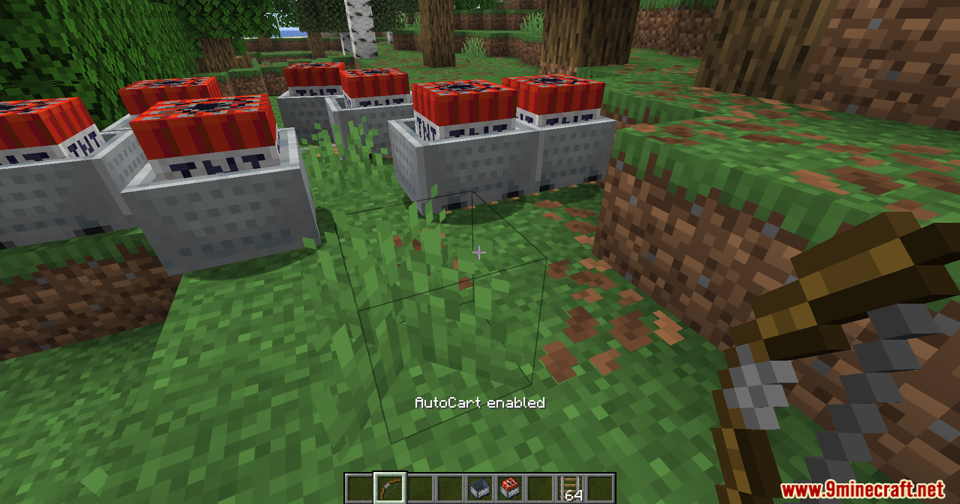 Auto Cart Mod (1.21.11) – Shoot Explosive Tnt Carts 9 A long line of tnt minecarts placed in a forest