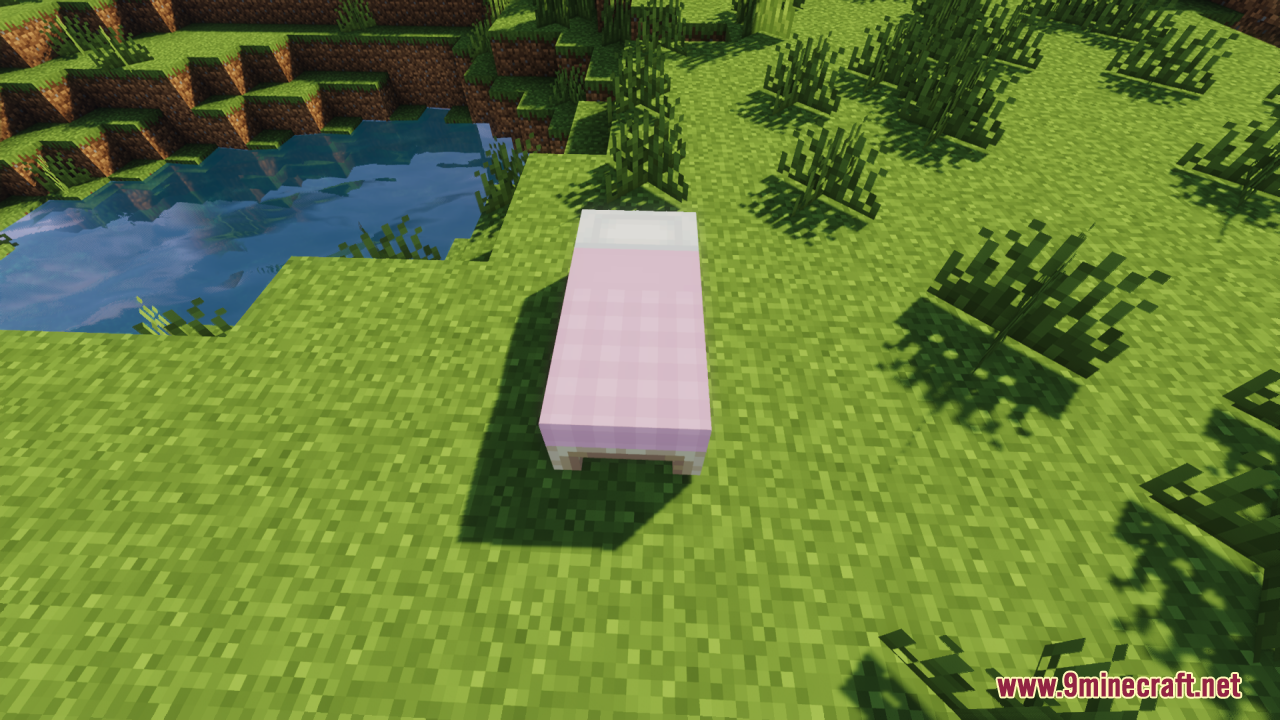 Cozy Nook Beds Resource Pack – Cozy Plaid Bedding For Rustic Cabins 2 A single pink plaid bed placed on grass near water