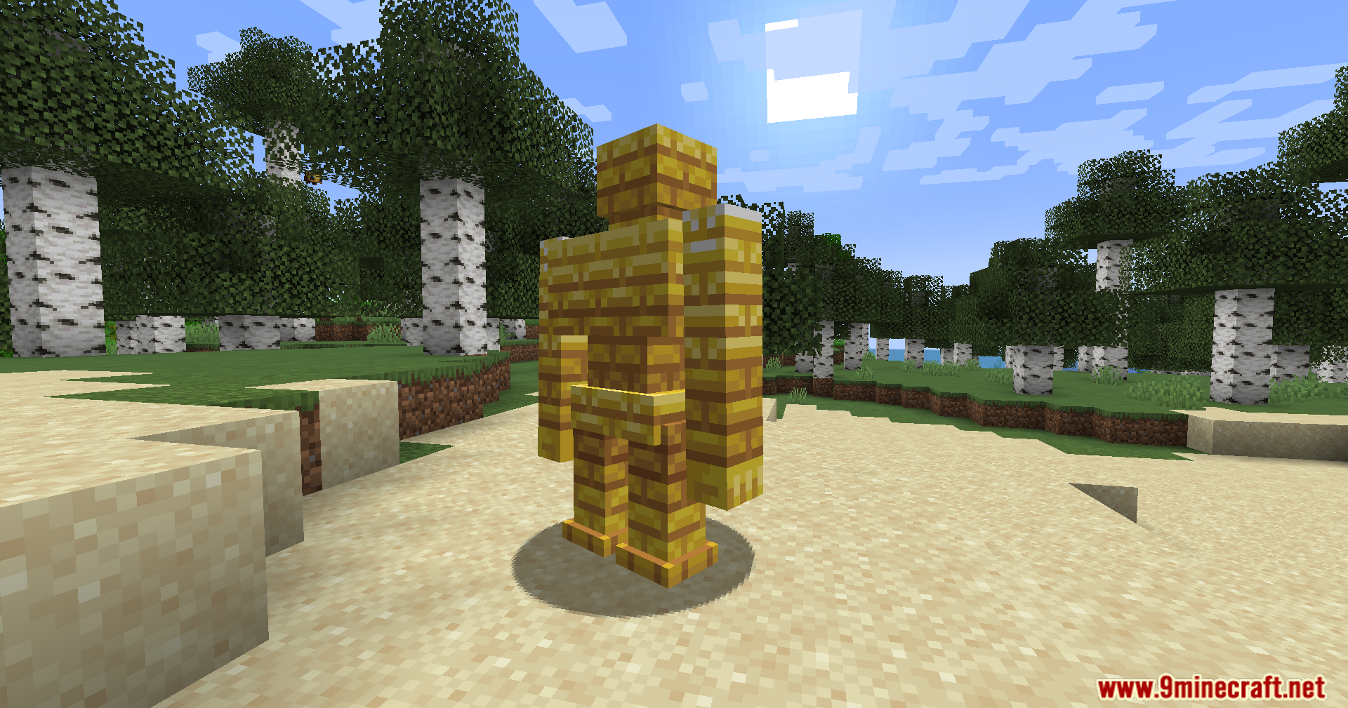 A large golem made of gold blocks on the sand