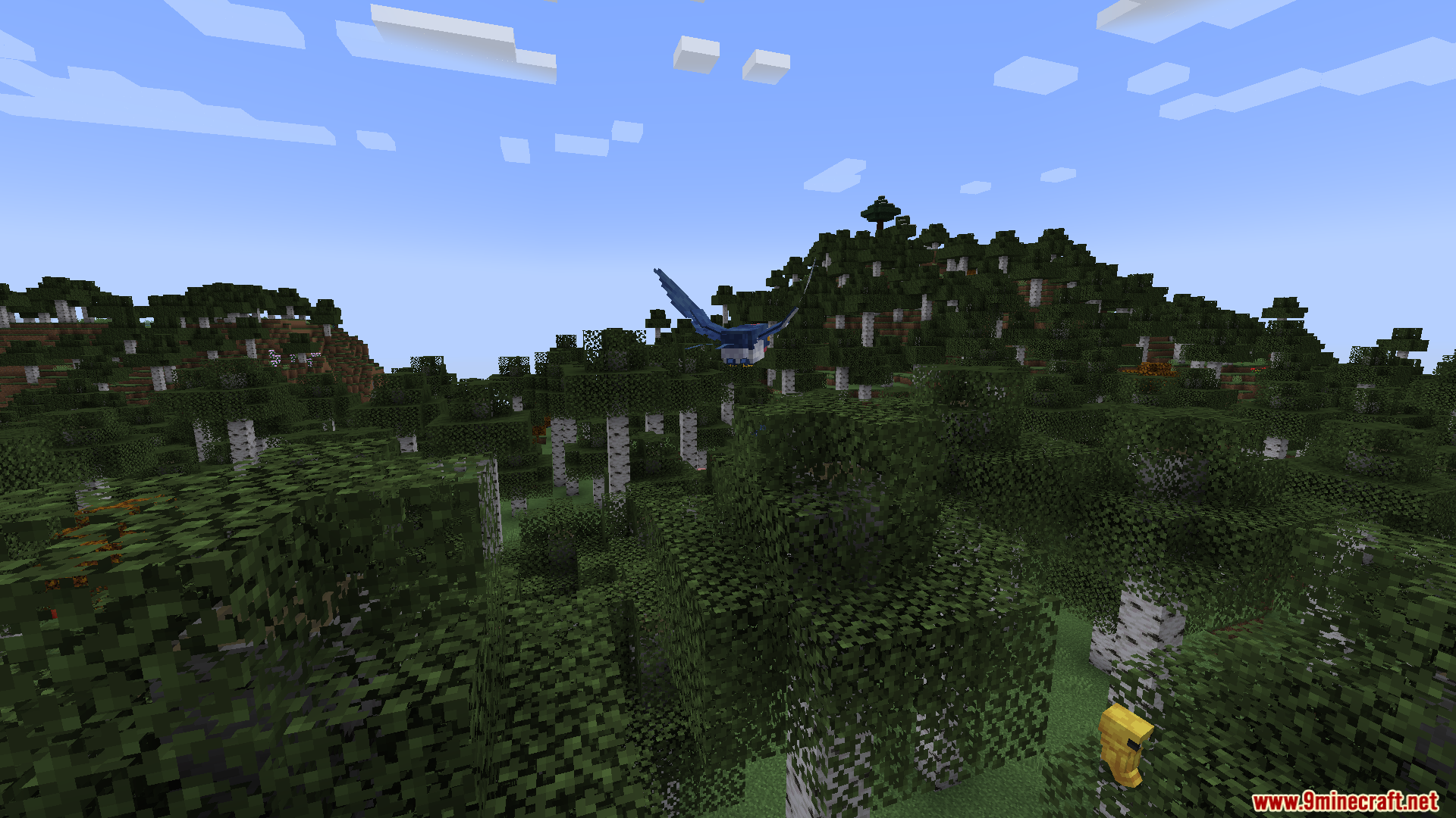 A large blue pokémon flying over a dense forest