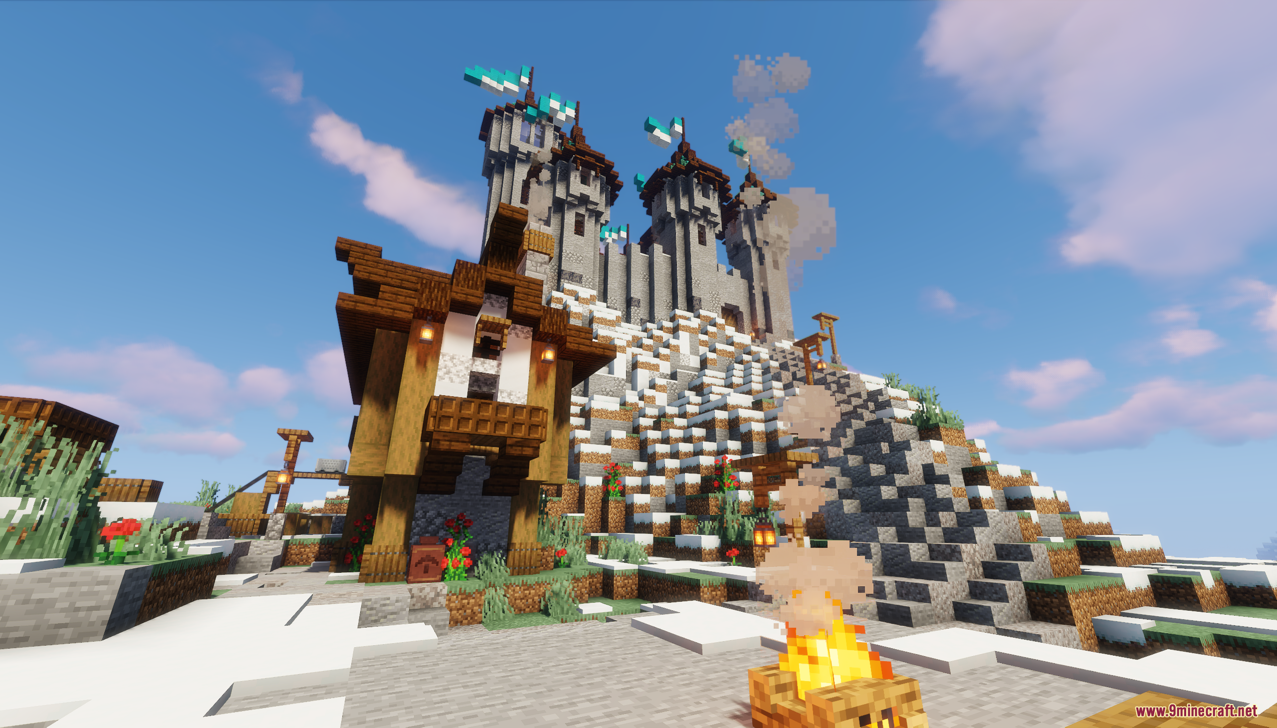 A medieval castle sits atop a snowy mountain