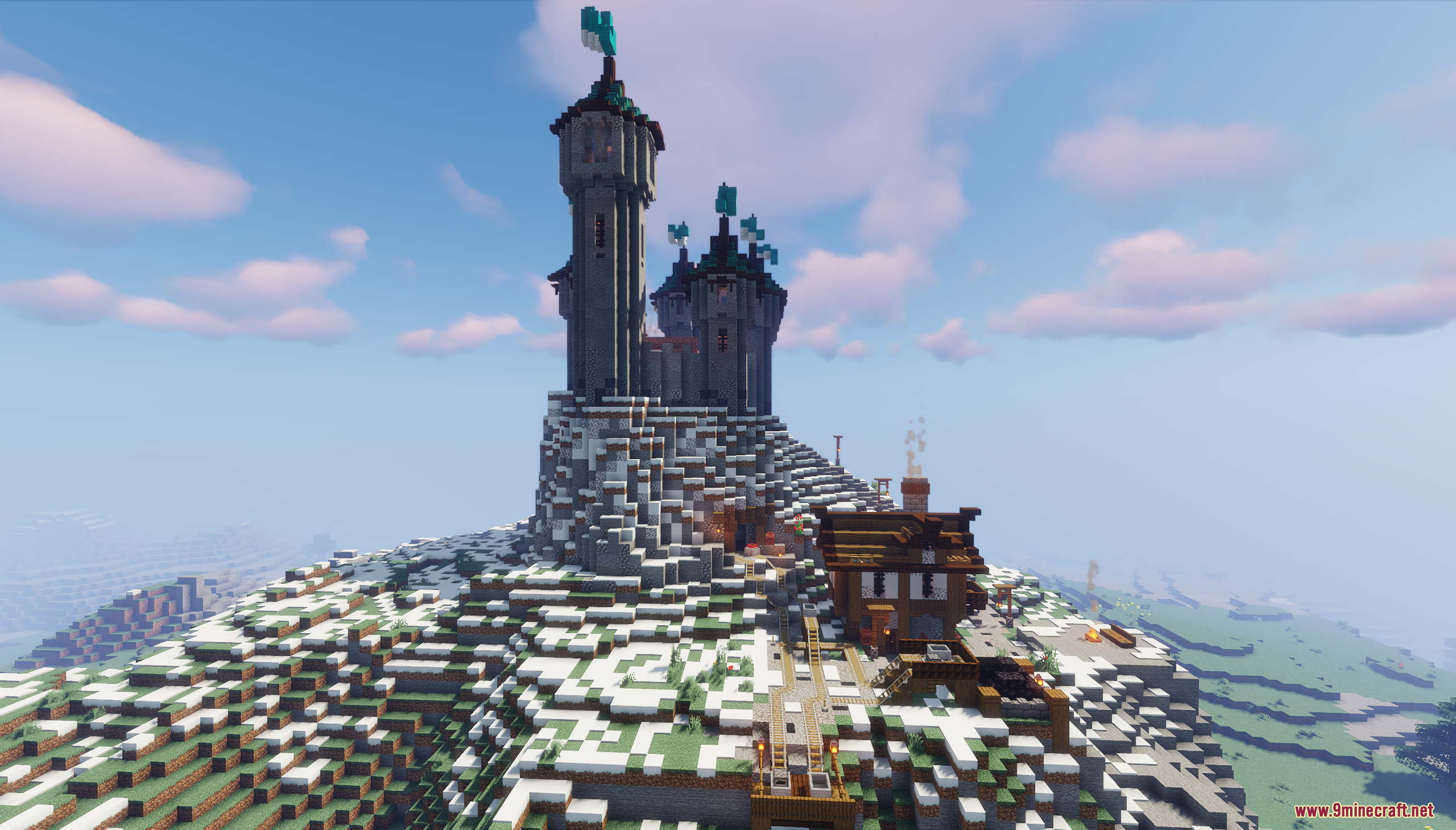 A large stone castle built on a snowy peak