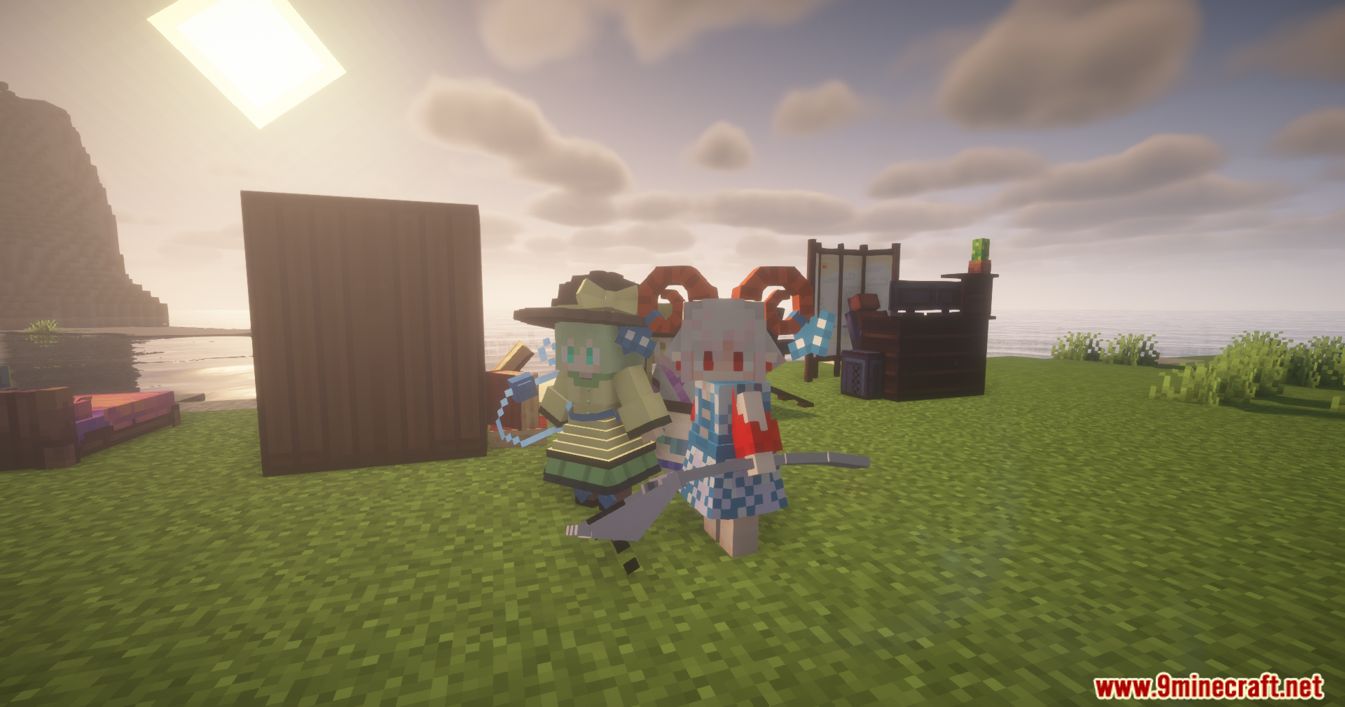 Two anime style maid characters standing in a grassy field near water