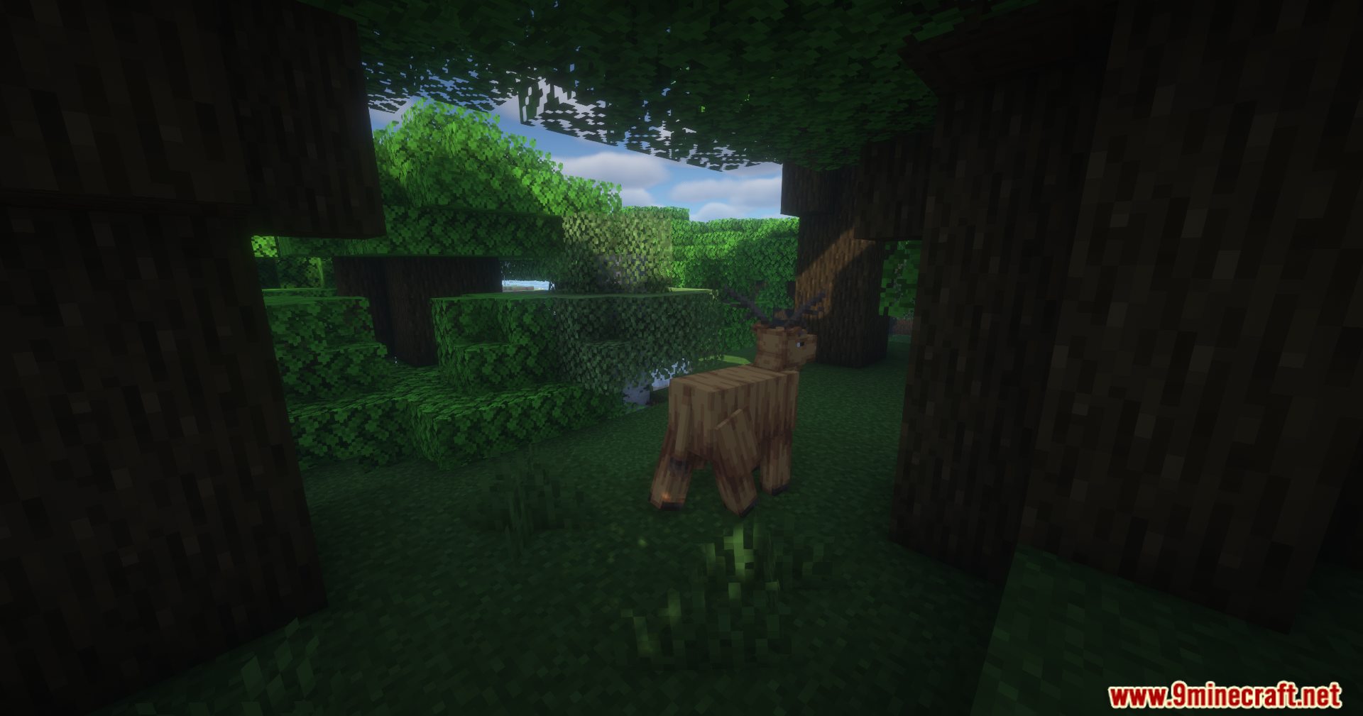 Brown blocky deer mob standing in a bright green minecraft forest clearing