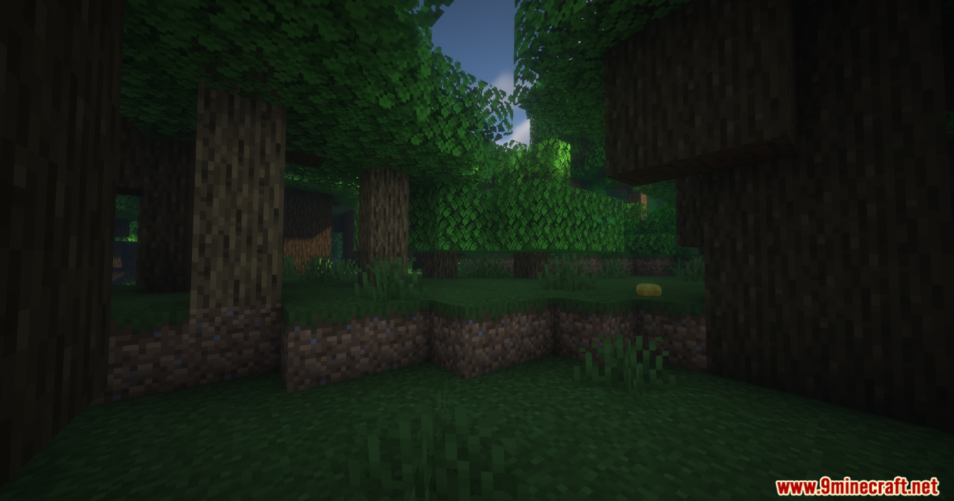 Sunlight filtering through the leaves in a dark minecraft forest