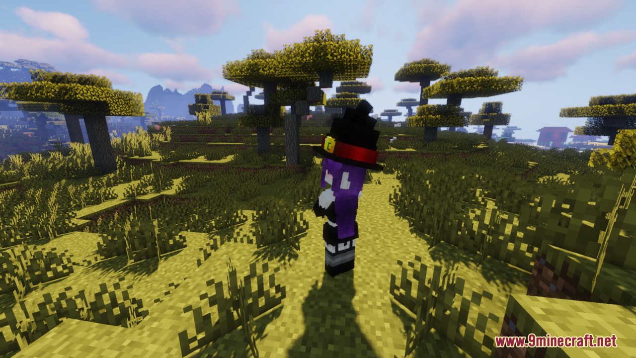A purple-haired witch character with a large black hat
