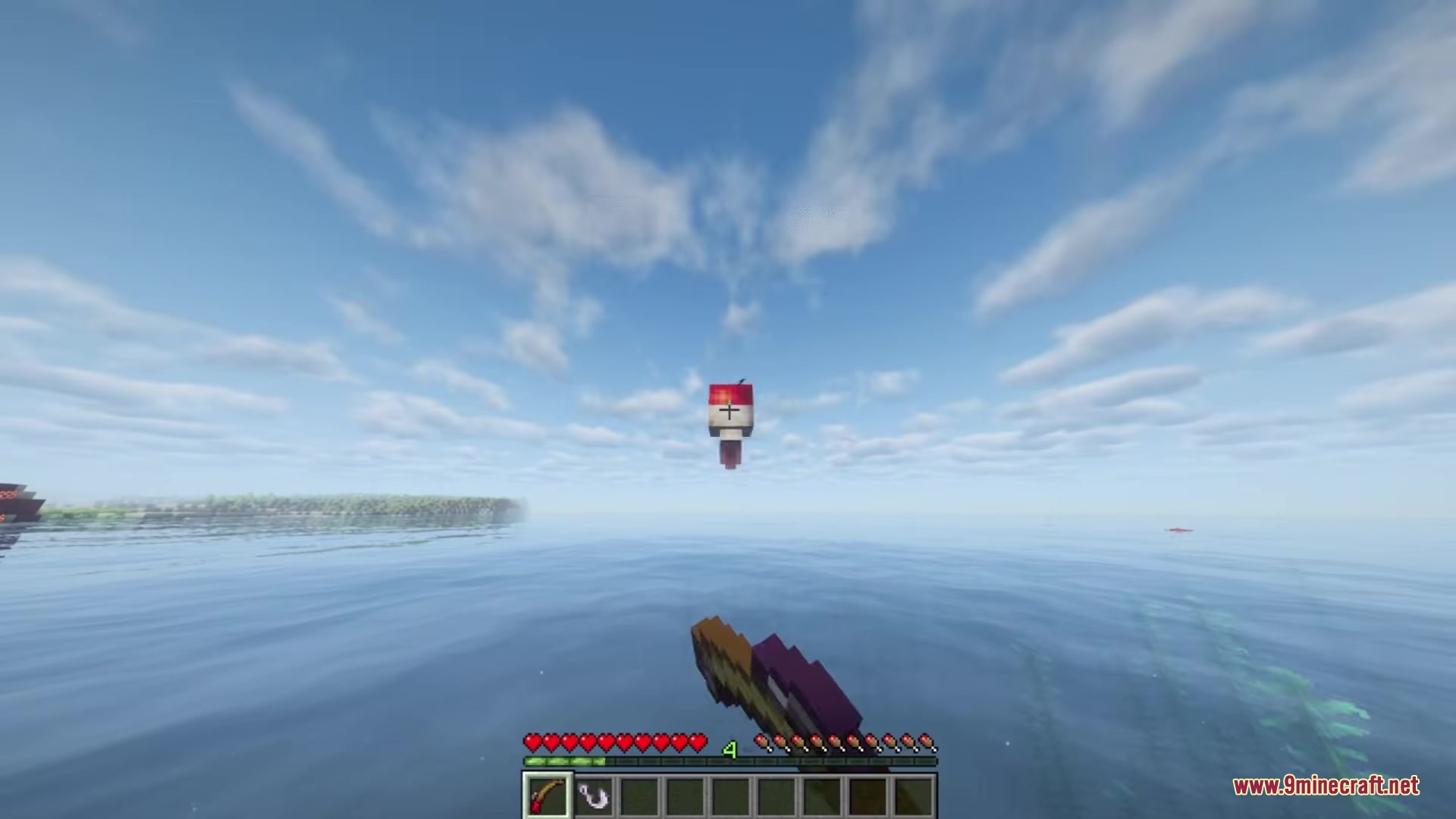 A fishing rod bobber floats on the calm water surface in a minecraft world