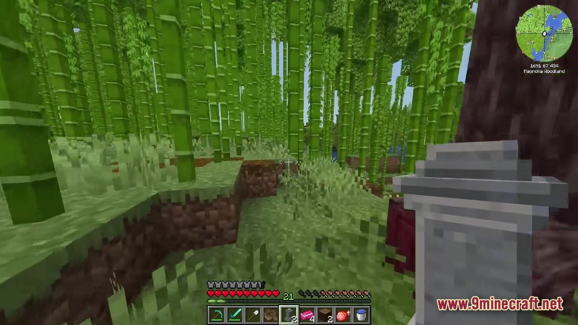 All The Mods 10 To The Sky Atm10 Sky Modpack (26.2, 1.21.1) – Build Your Empire 5 A player explores a dense bamboo forest biome while holding a decorative stone grave marker