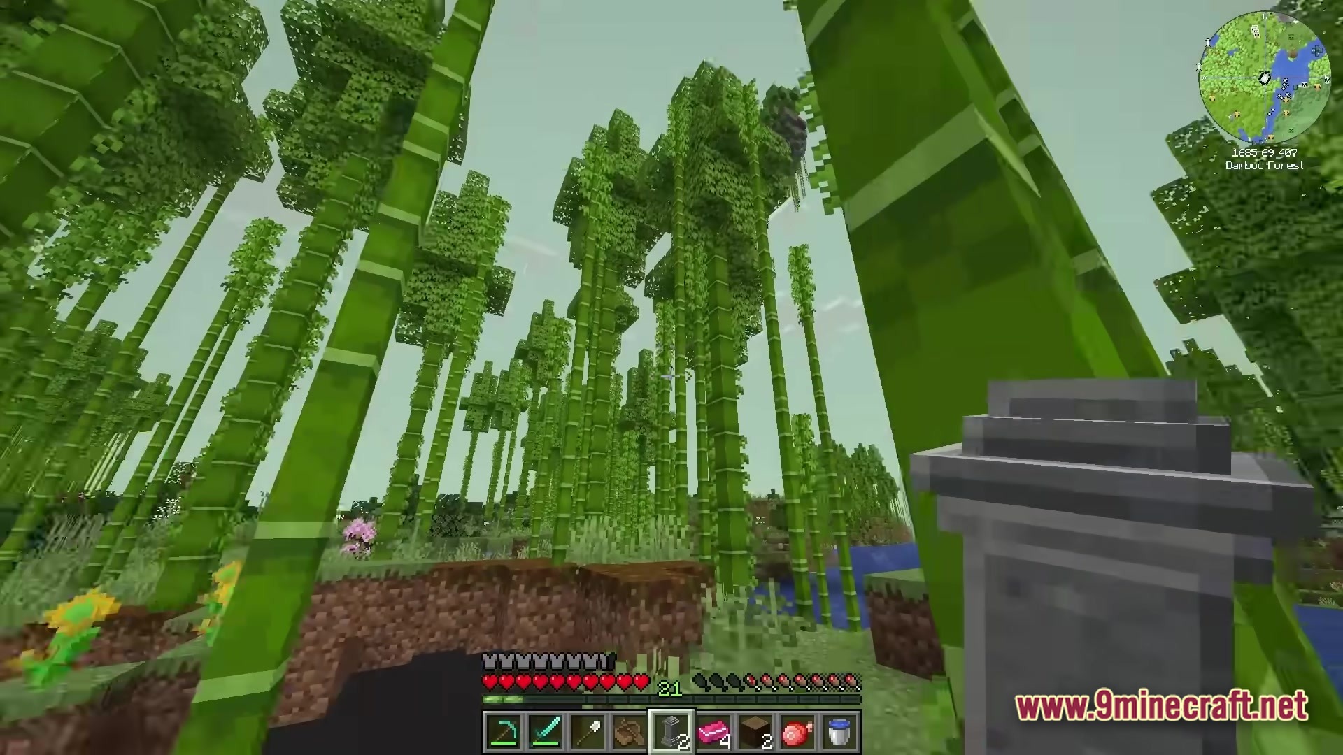 All The Mods 10 To The Sky Atm10 Sky Modpack (26.2, 1.21.1) – Build Your Empire 6 A player explores a dense bamboo forest biome while holding a decorative stone pillar item