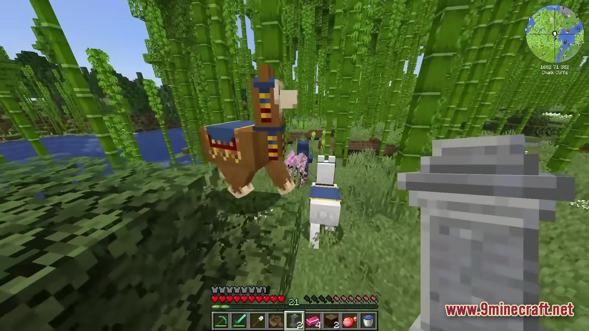 All The Mods 10 To The Sky Atm10 Sky Modpack (26.2, 1.21.1) – Build Your Empire 7 A wandering trader with two llamas stands in a bamboo forest near a stone waystone