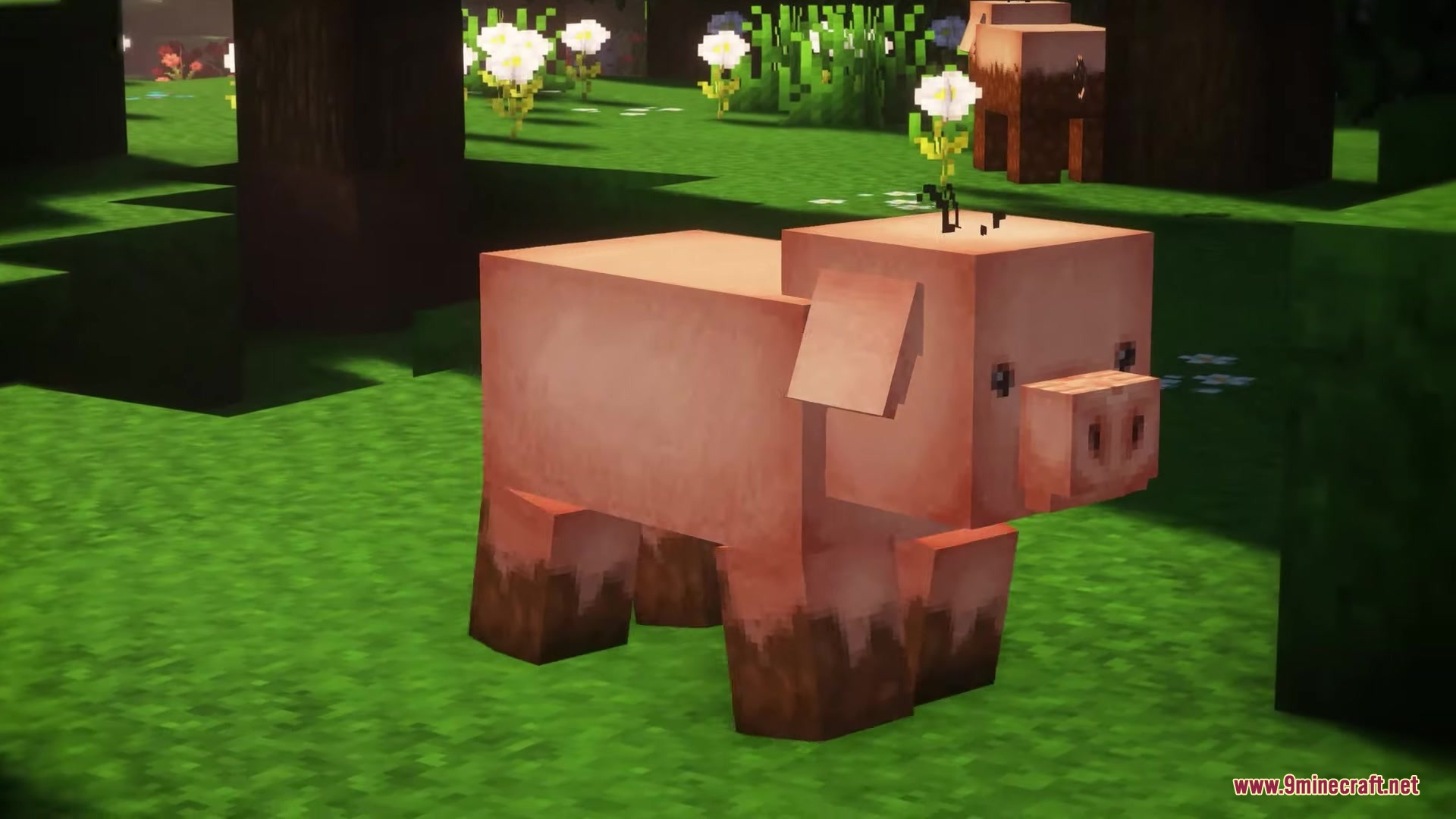 A pink pig with muddy feet and a flower on its head in grass
