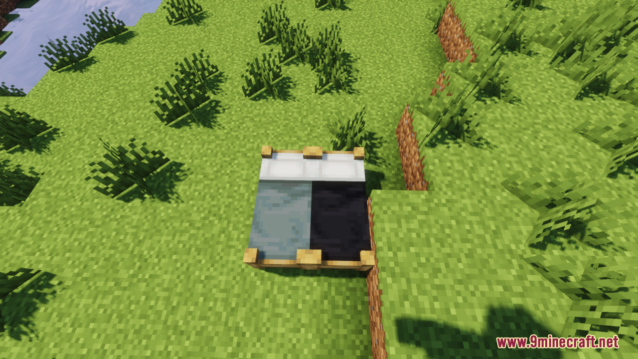 Cozy light blue and black beds with detailed wooden frames on grass