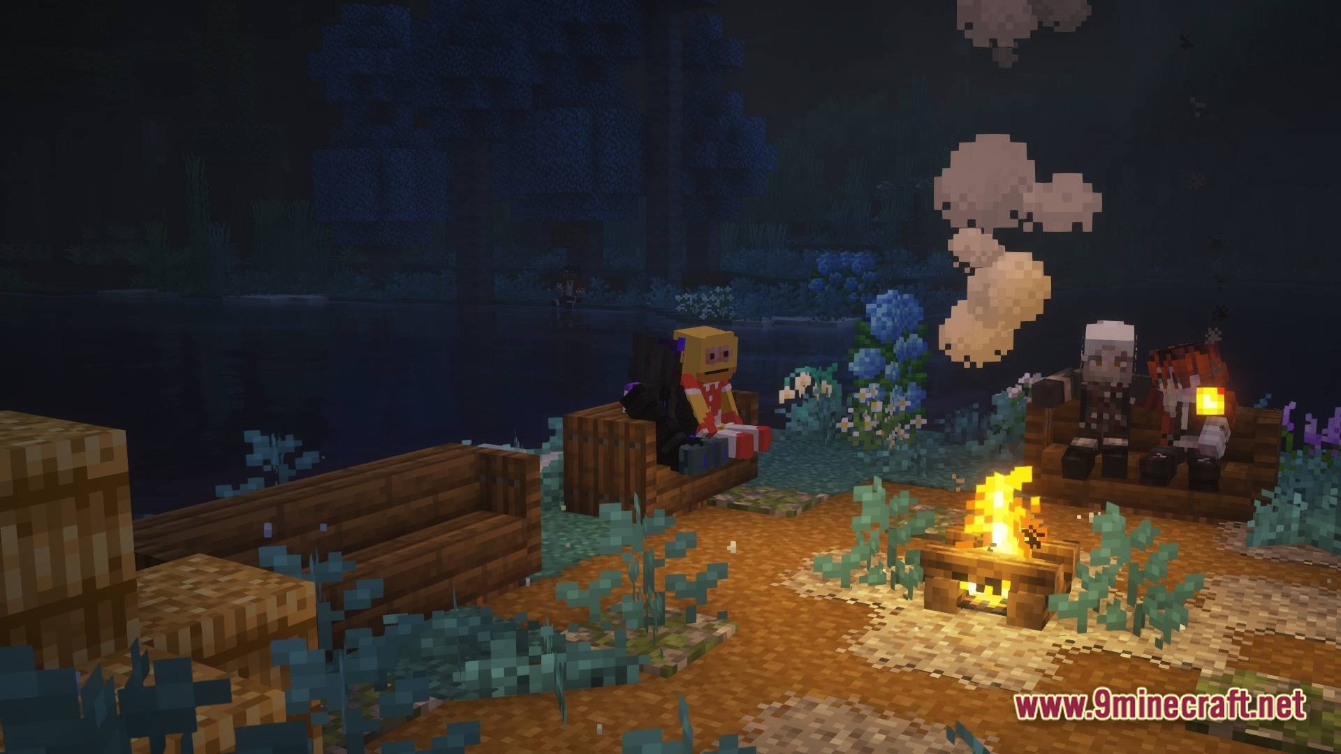 Three players sit on wooden benches around a lit campfire at night near a river
