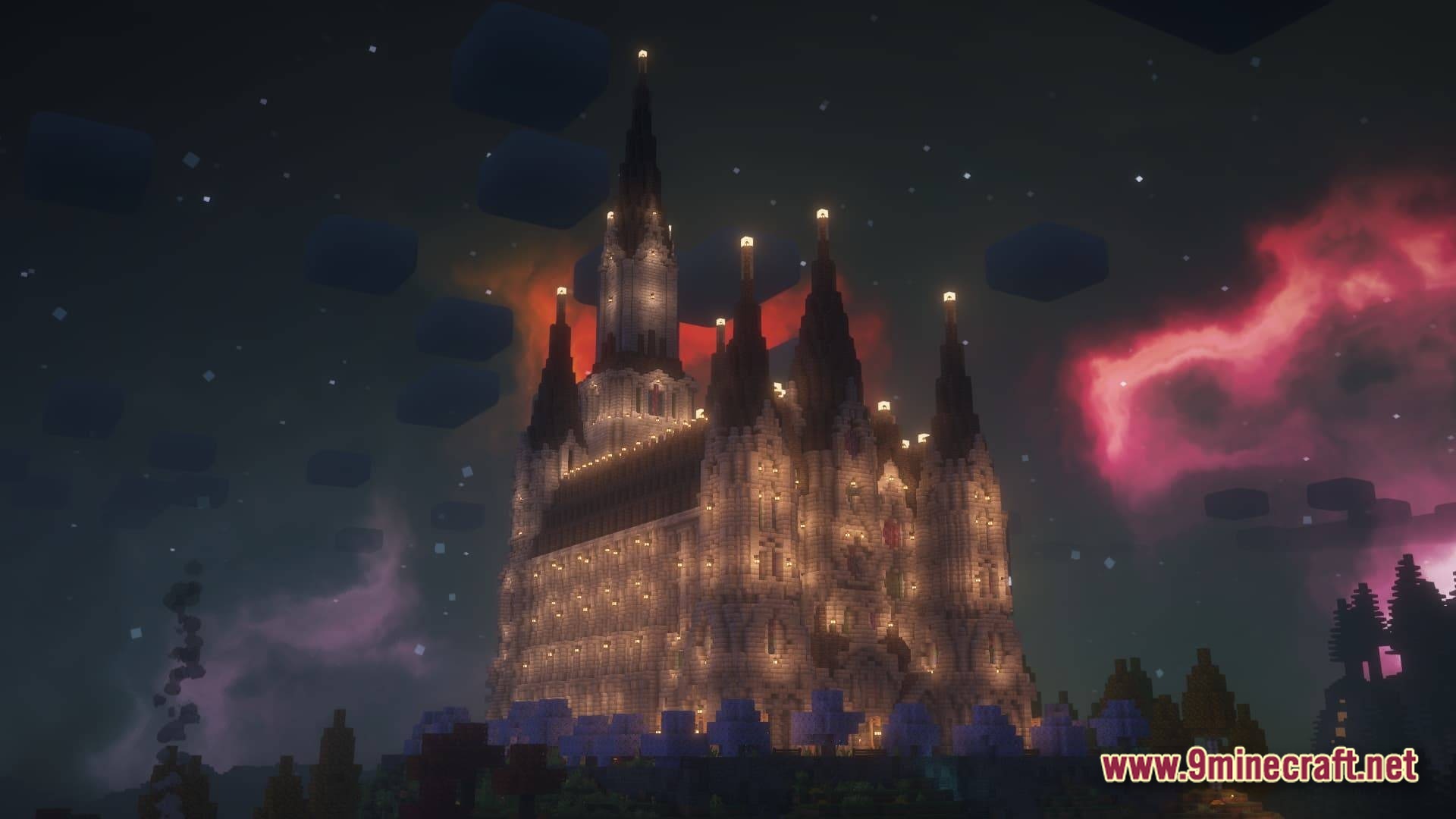 A large gothic cathedral structure illuminated at night under a purple and red nebula sky