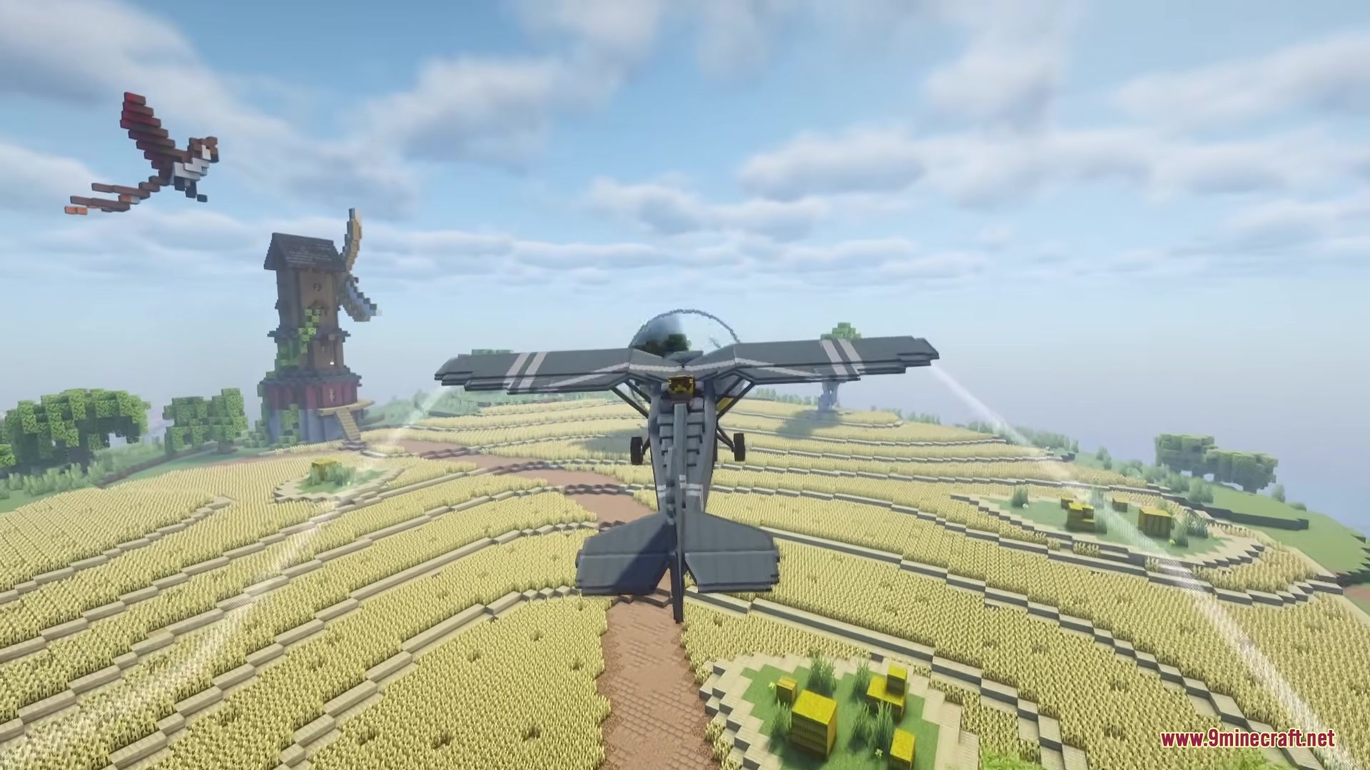 Civilian Aviation Mod (1.21.1, 1.20.1) – Pilot Modern Planes And Helicopters 7 A modern aircraft flying over a large circular wheat farm in minecraft