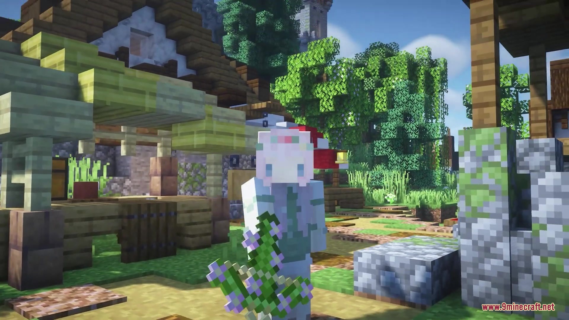Flowering Oak Leaves Resource Pack (1.19.2, 1.18.2) – Springtime Blossoms 2 A minecraft player holding a block of oak leaves with pink flowers