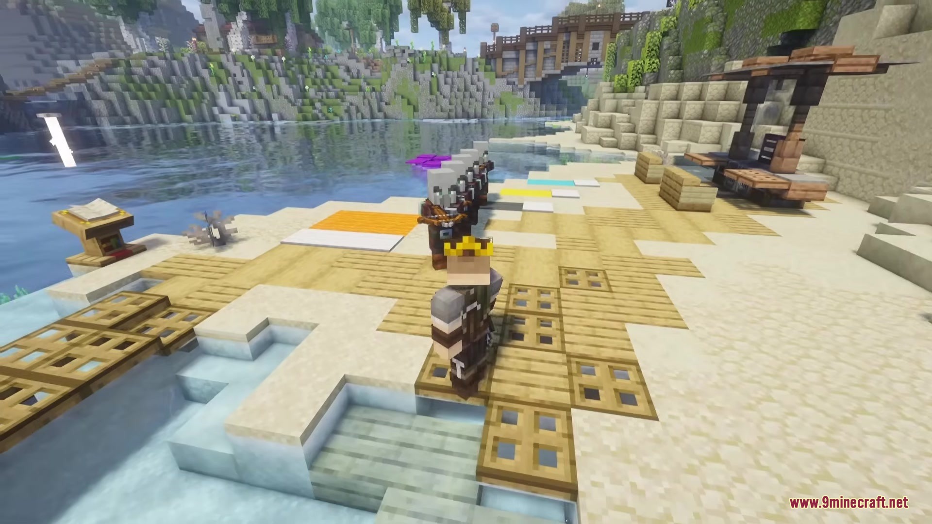 Jaam’s Weaponry Mod (1.20.1) – Master New Fighting Styles Against Armed Enemies 5 A player wearing a crown looks at armor stands holding crossbows on a beach
