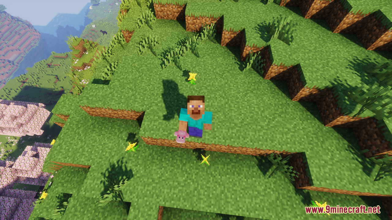 Kirby Totem Of Undying Resource Pack (1.21.11, 1.21.1) – Lovely Figure Into Your Game 5 A player holds a pink kirby totem while standing on a grassy cliff