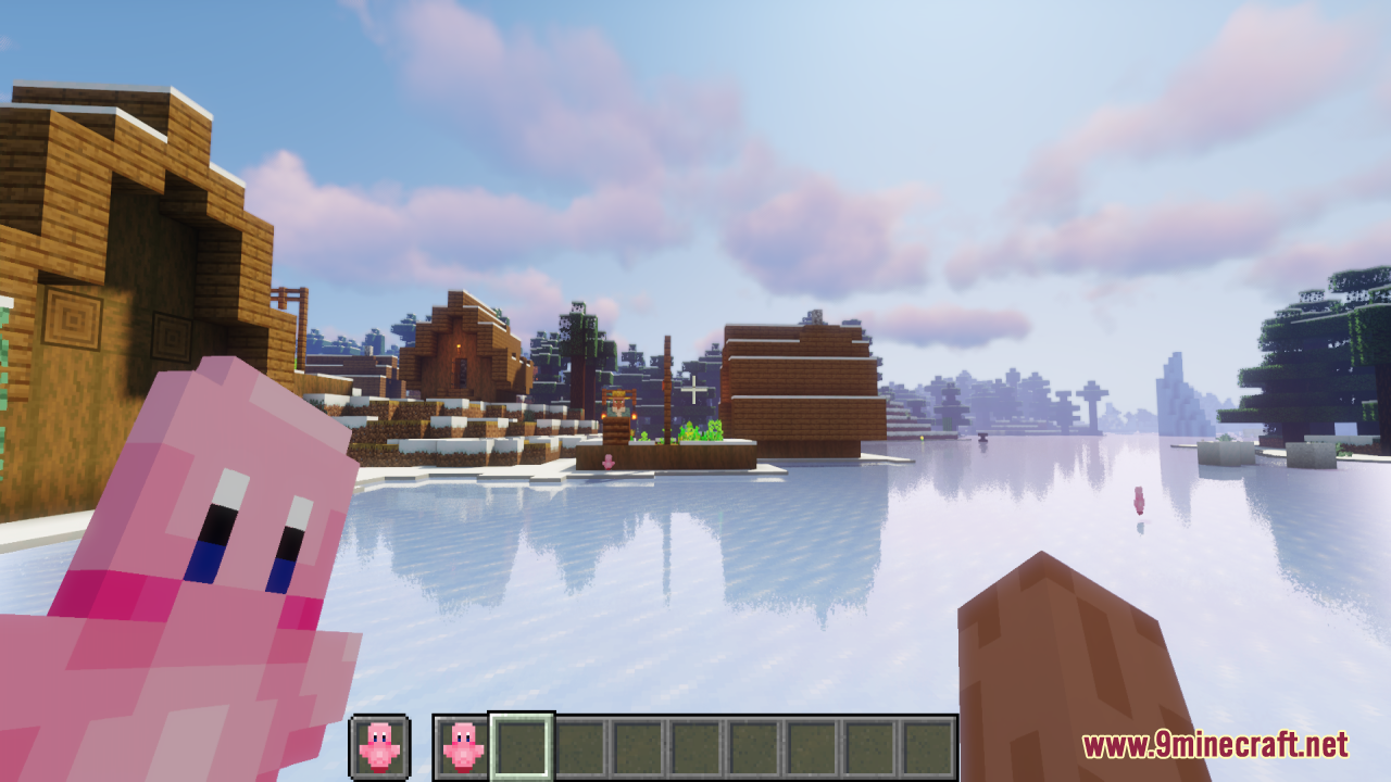 Kirby Totem Of Undying Resource Pack (1.21.11, 1.21.1) – Lovely Figure Into Your Game 10 Player holding a kirby totem of undying while looking at a snowy village