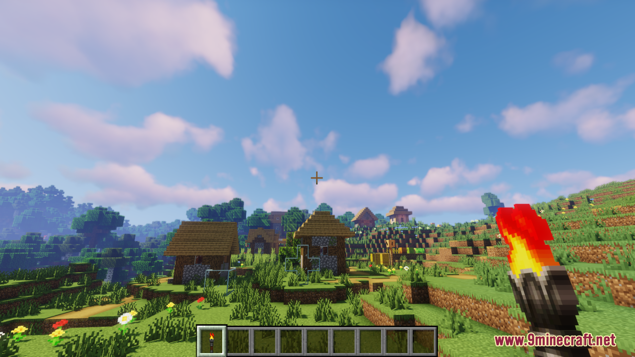 Lz Rustic Torch Resource Pack (1.21.11, 1.21.1) – Old-School Rustic Charm 3 A player holds a custom rustic torch while standing in a sunny village