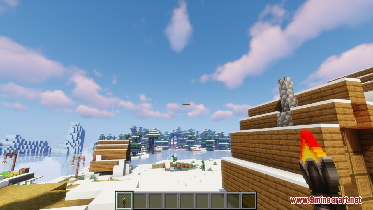 Lz Rustic Torch Resource Pack (1.21.11, 1.21.1) – Old-School Rustic Charm 7 A player holding a rustic torch while exploring a snowy village