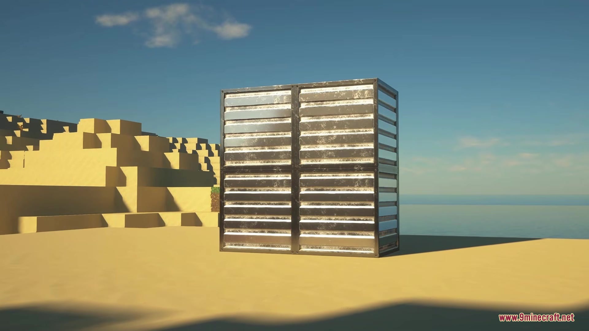 A metallic block structure standing in a desert biome with high definition textures