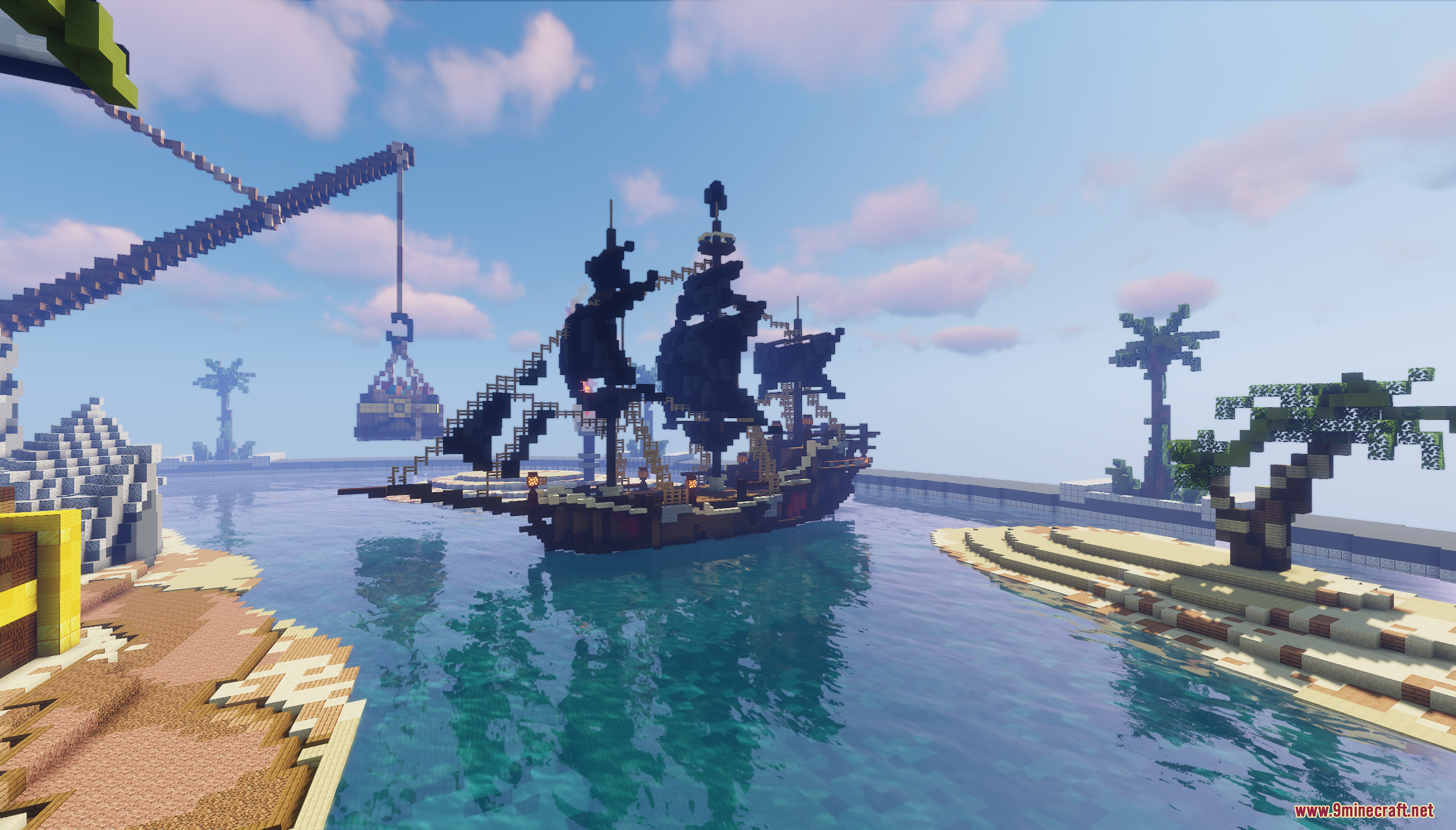 A pirate ship with black sails anchored in a tropical bay with palm trees