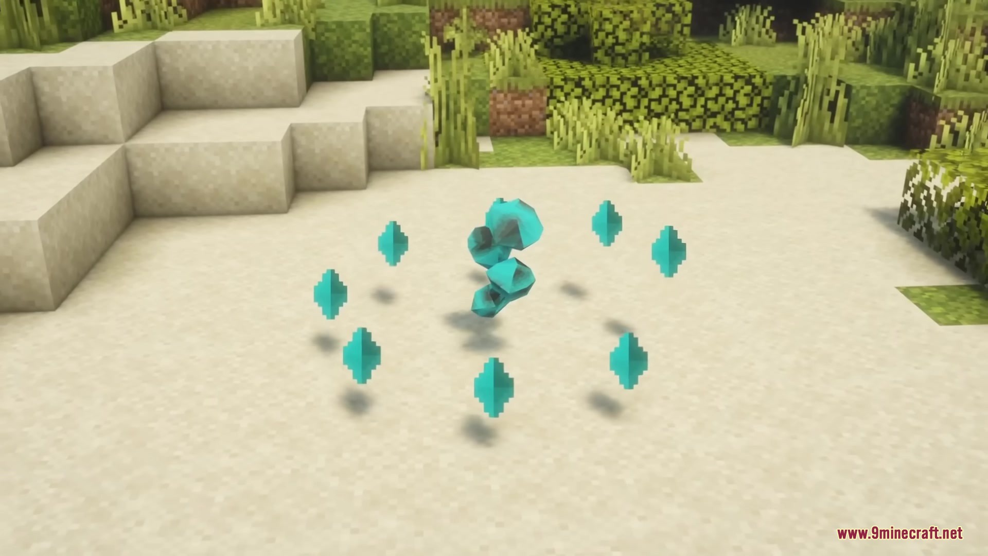 Several glowing cyan shards floating in a circular pattern on the sand