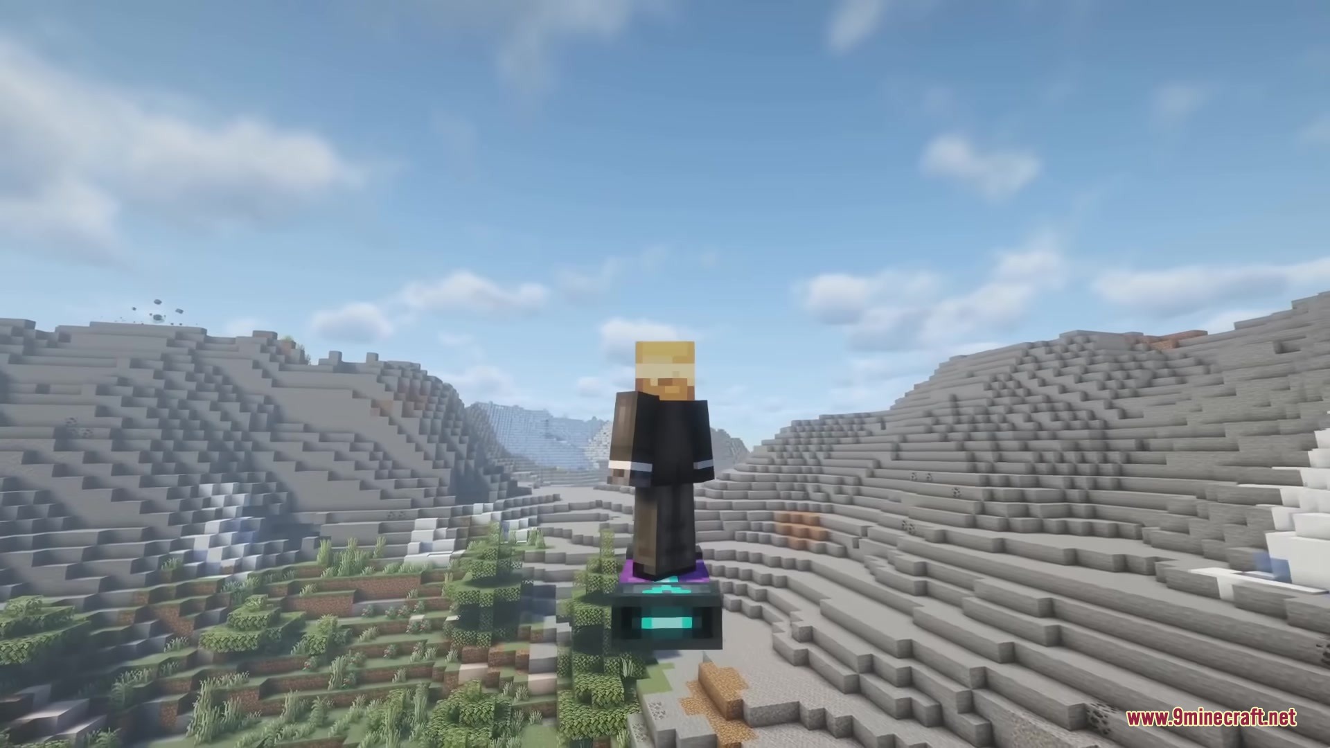 A player character uses a hoverboard to fly over a vast mountain range
