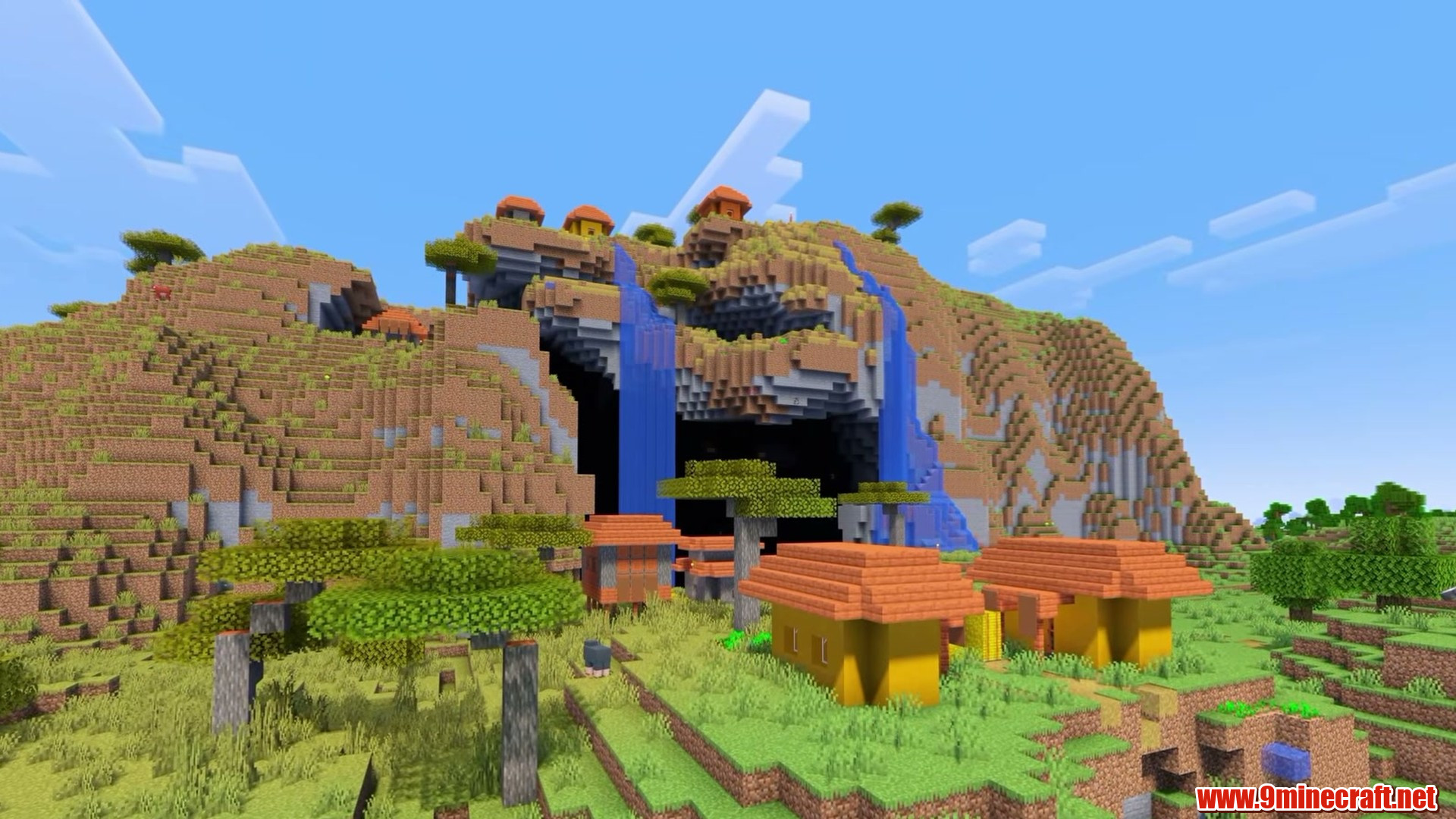 Top 15 Village Seeds For Your Next Minecraft World (26.2, 1.21.11) – Java Edition 3 Cave mouth looming over the village houses