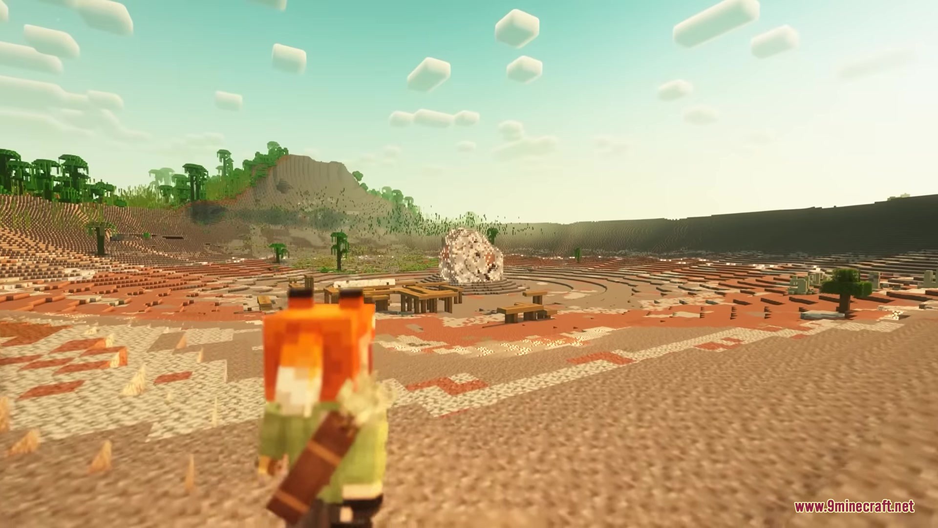 A player overlooks a massive meteor crater from undermod in a desert biome