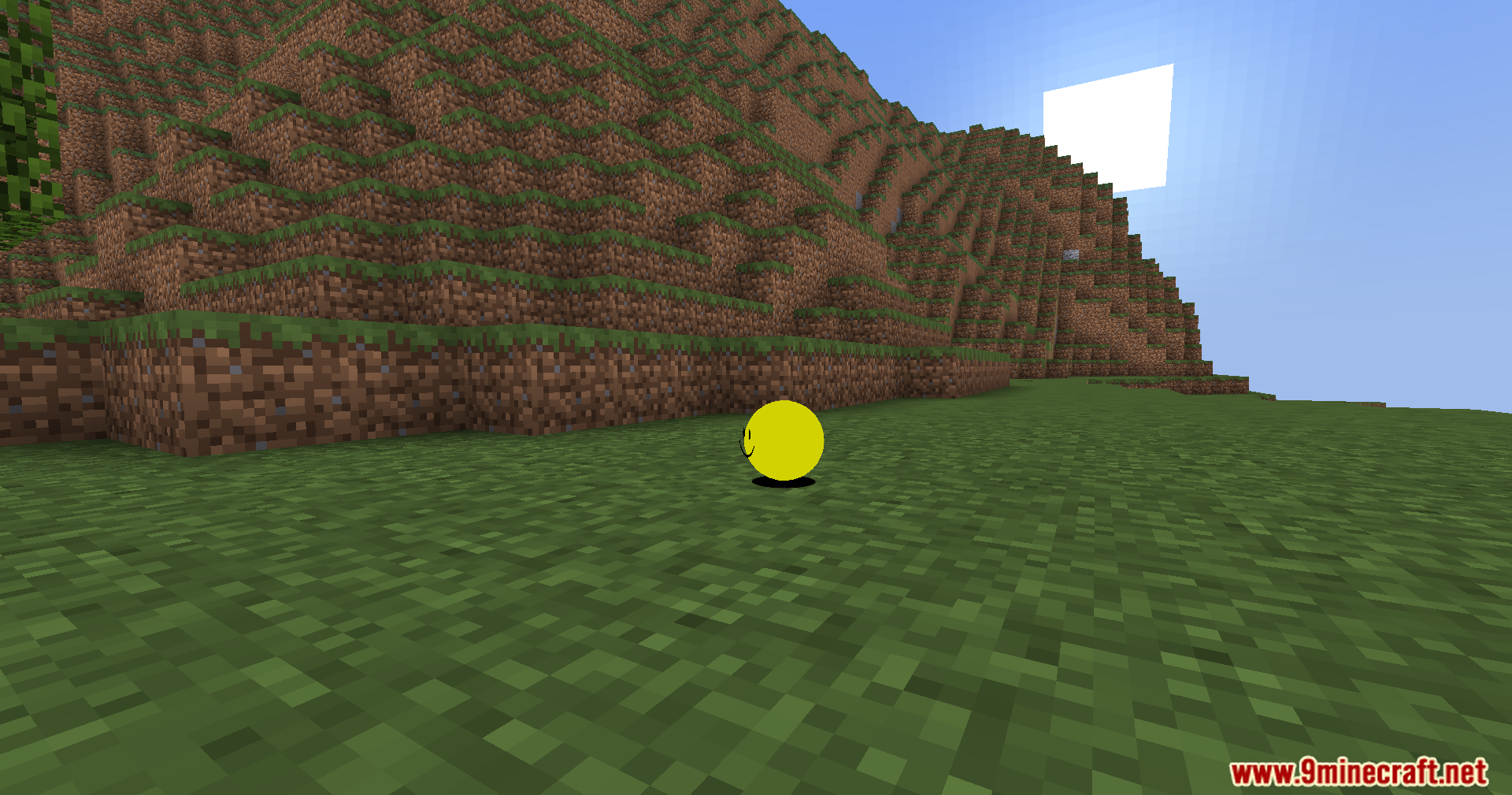 Verity Shaders (1.20.1) – Smooth Sphere Rendering For The Verity Mod 3 A round yellow sphere with a face stands in a hilly landscape