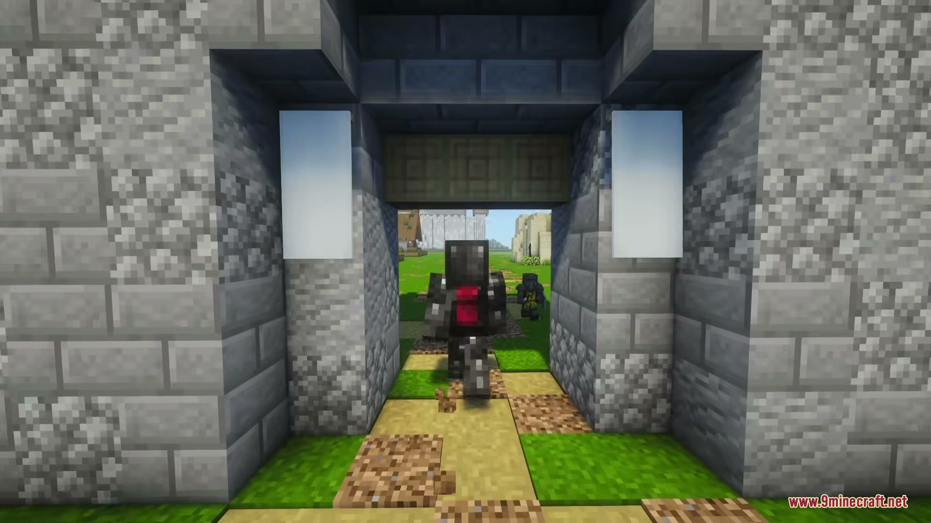 A Game Of Blocks Mod (1.21.1) – Rule Your Own Medieval Kingdom 11 Two soldiers walking through a stone gate into a grassy field