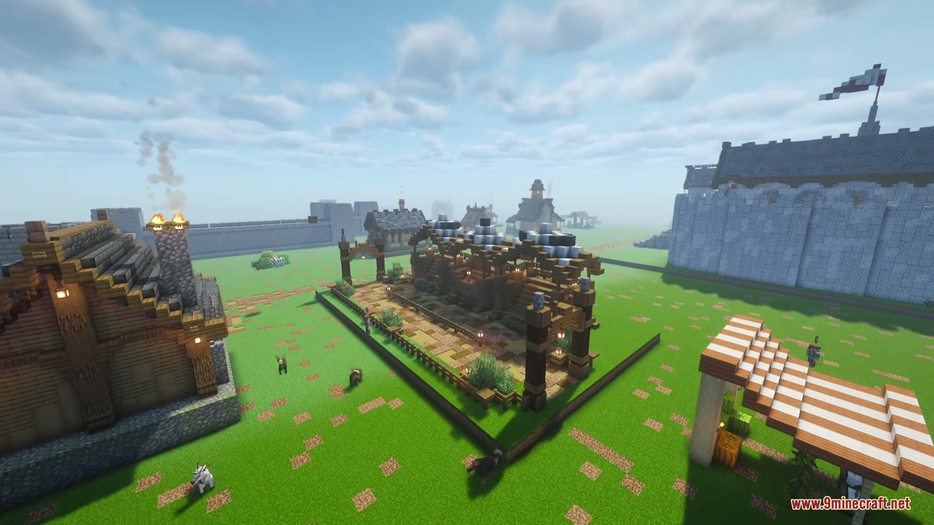 A Game Of Blocks Mod (1.21.1) – Rule Your Own Medieval Kingdom 7 Aerial view of a medieval kingdom with wooden houses and large stone walls