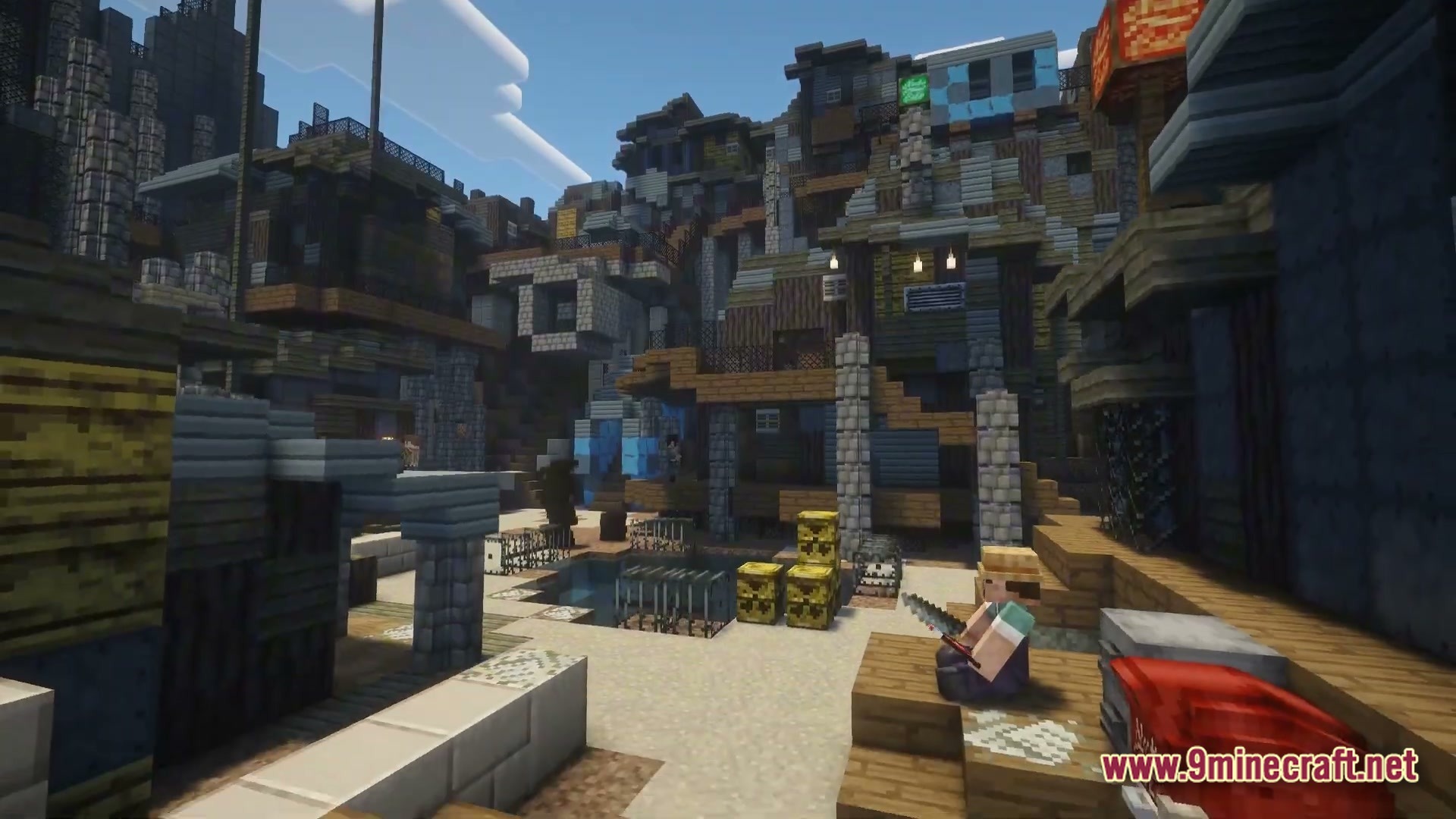 A player sits in a post-apocalyptic shanty town built from scrap wood and stone materials