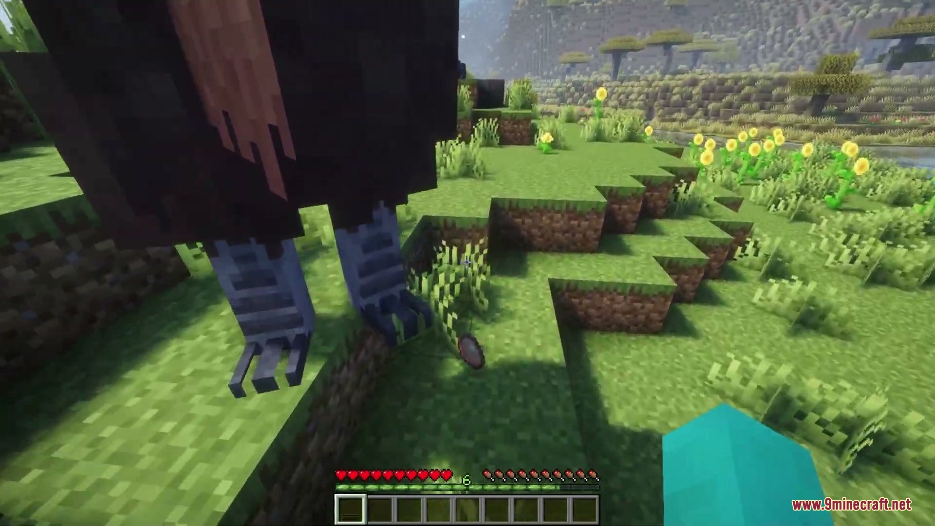 Anachronistic Wilds Mod (1.20.1) – Summon And Breed Extinct Prehistoric Wildlife 8 A massive elephant bird from anachronistic wilds mod stands in a grassy field