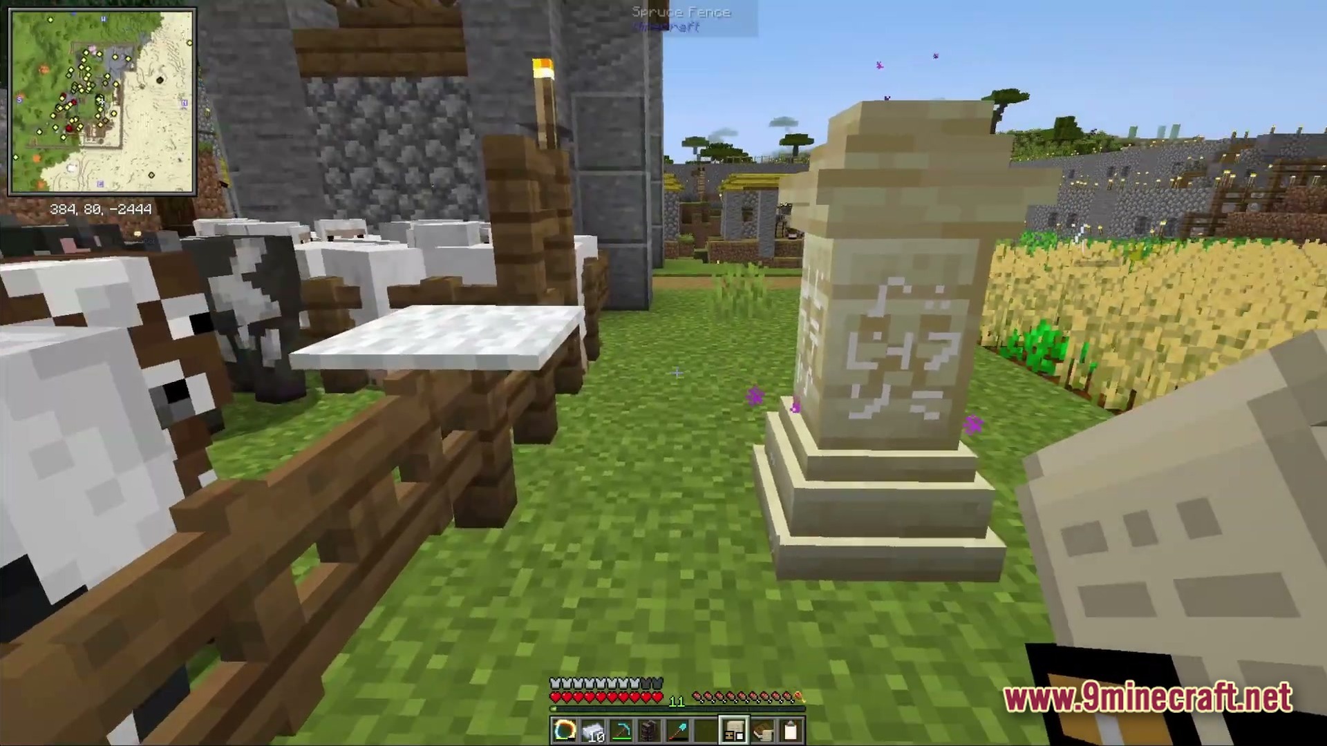 Ancient Kingdoms 3 Modpack (1.20.1) – Build Kingdoms Master Magic Slay 2 A waystone stands near a livestock pen and wheat farm within a fortified village settlement