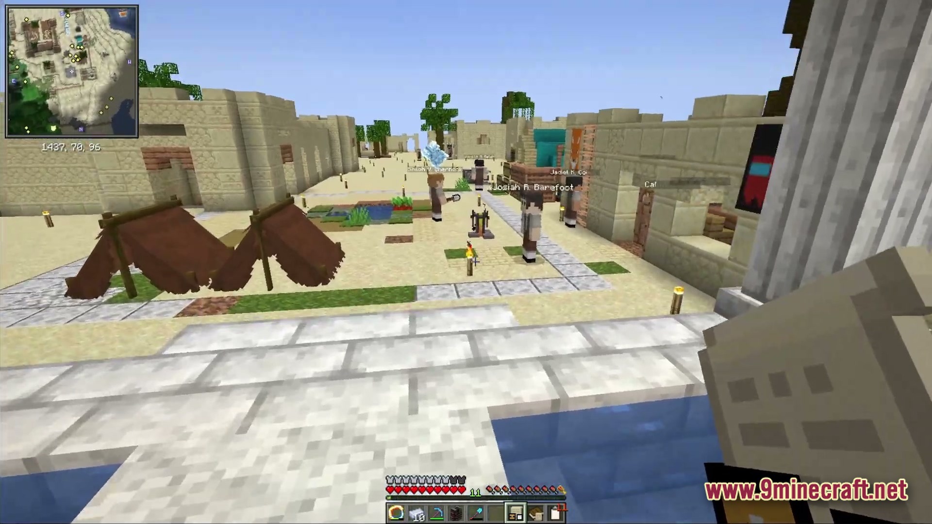 Ancient Kingdoms 3 Modpack (1.20.1) – Build Kingdoms Master Magic Slay 3 Several npcs stand near sandstone buildings and tents in a desert village settlement