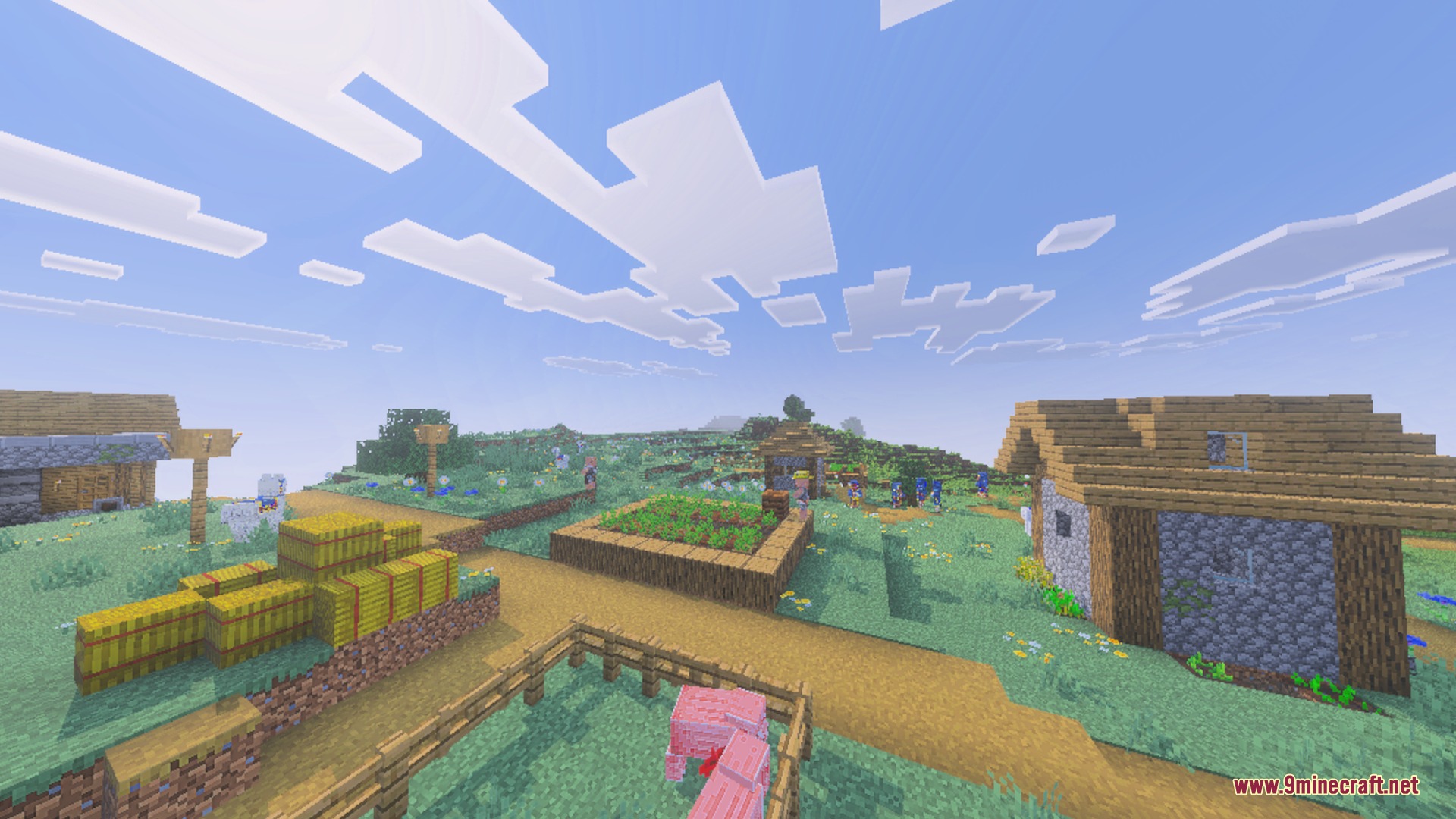 Vibrant minecraft village with hay bales and garden plots under a bright clear sky