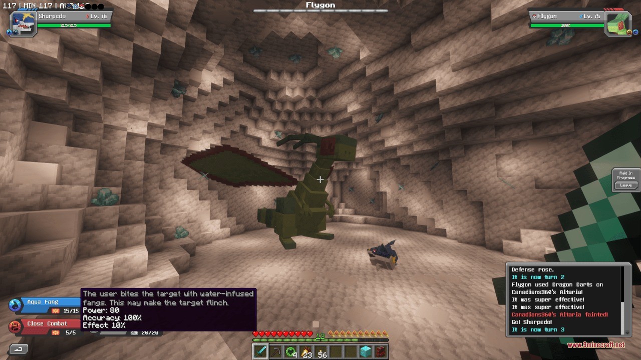 A player battles a giant flygon raid boss inside a rocky cave