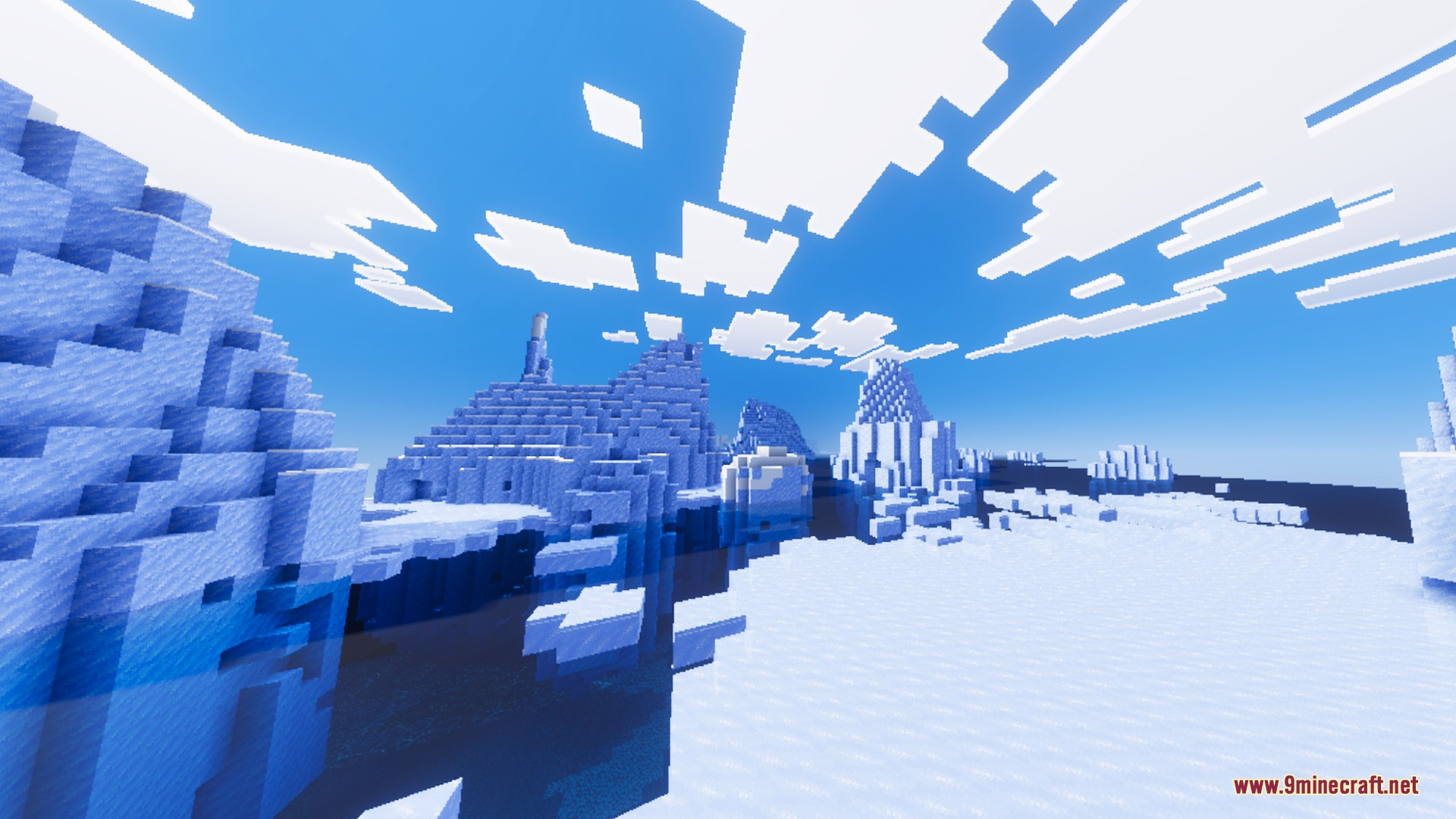 Large blue icebergs floating in a frozen ocean under blocky white clouds