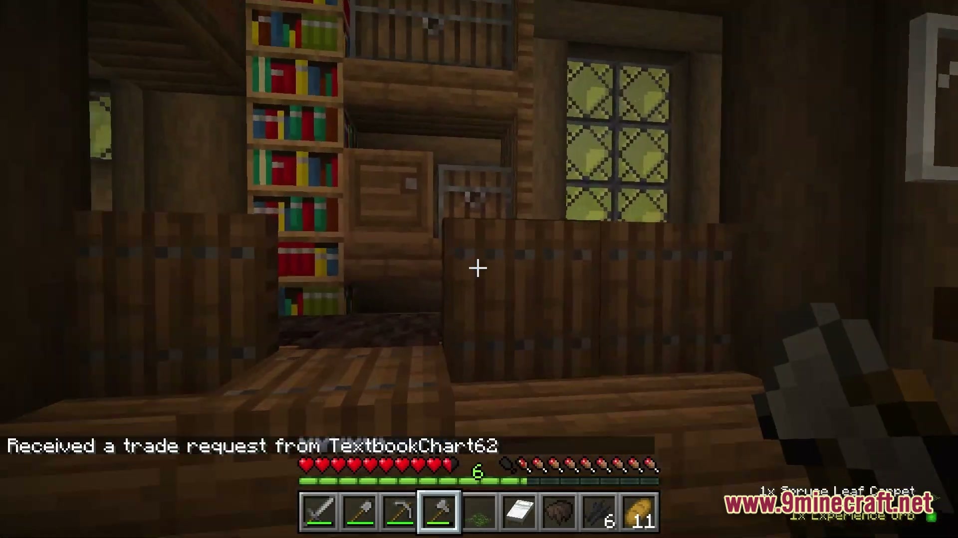 Arcanum Land Modpack (1.20.1) – Magic Dragons And Rpg Adventures 6 A player stands inside a wooden building featuring bookshelves, barrels, and a trade request notification